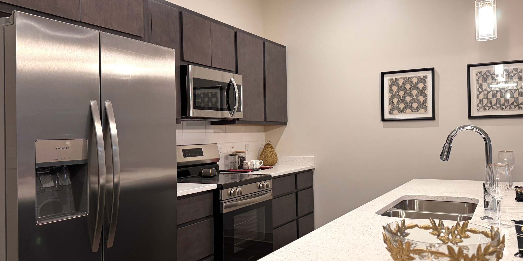 Kitchen with stainless-steel appliances at The Maxx and The Alexandra in Pittsburgh,Pennsylvania