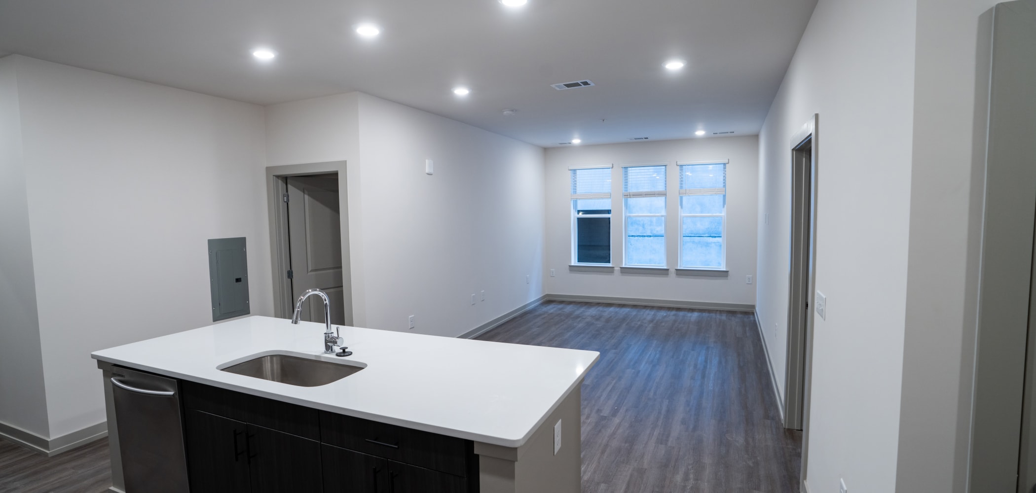 Living Room & Kitchen Island at The Jolly Roger |Student Apartments in Greenville, North Carolina