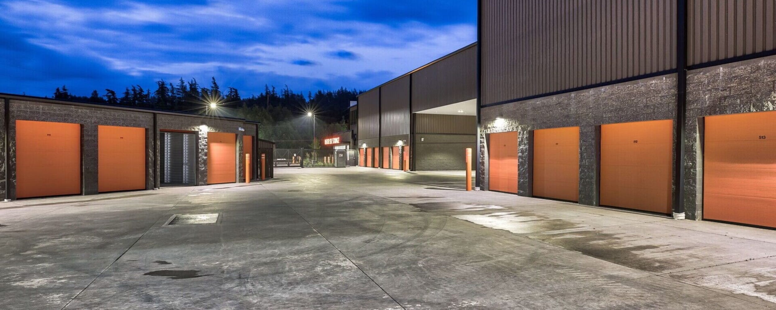 Exterior units with orange doors at Advanced Heated Self Storage Bellingham in Bellingham, Washington