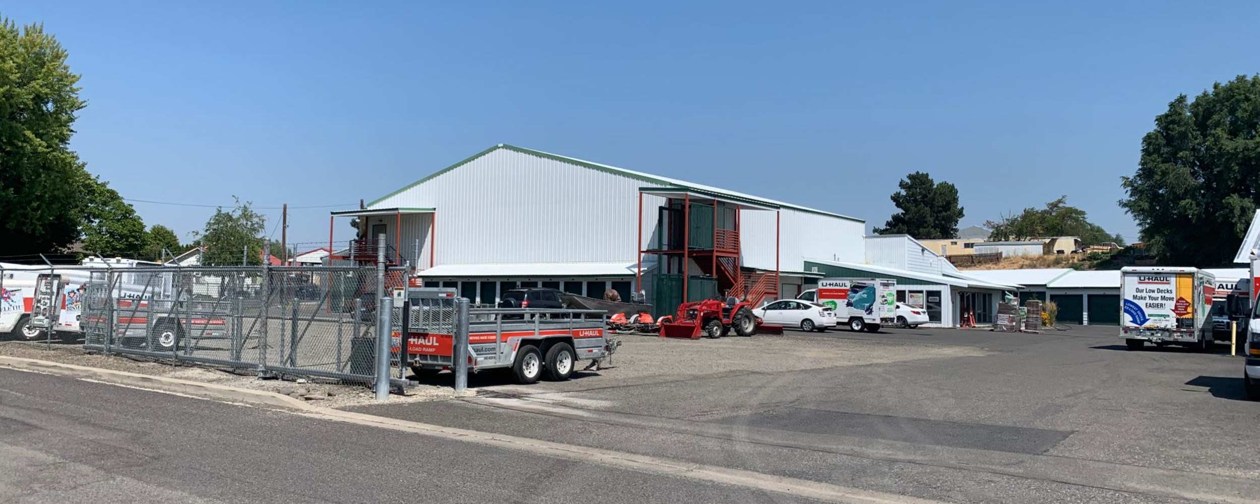 A storage facility parking lot featuring a variety of RVs parked at AAA Wildcat Storage, Ellensburg, Washington