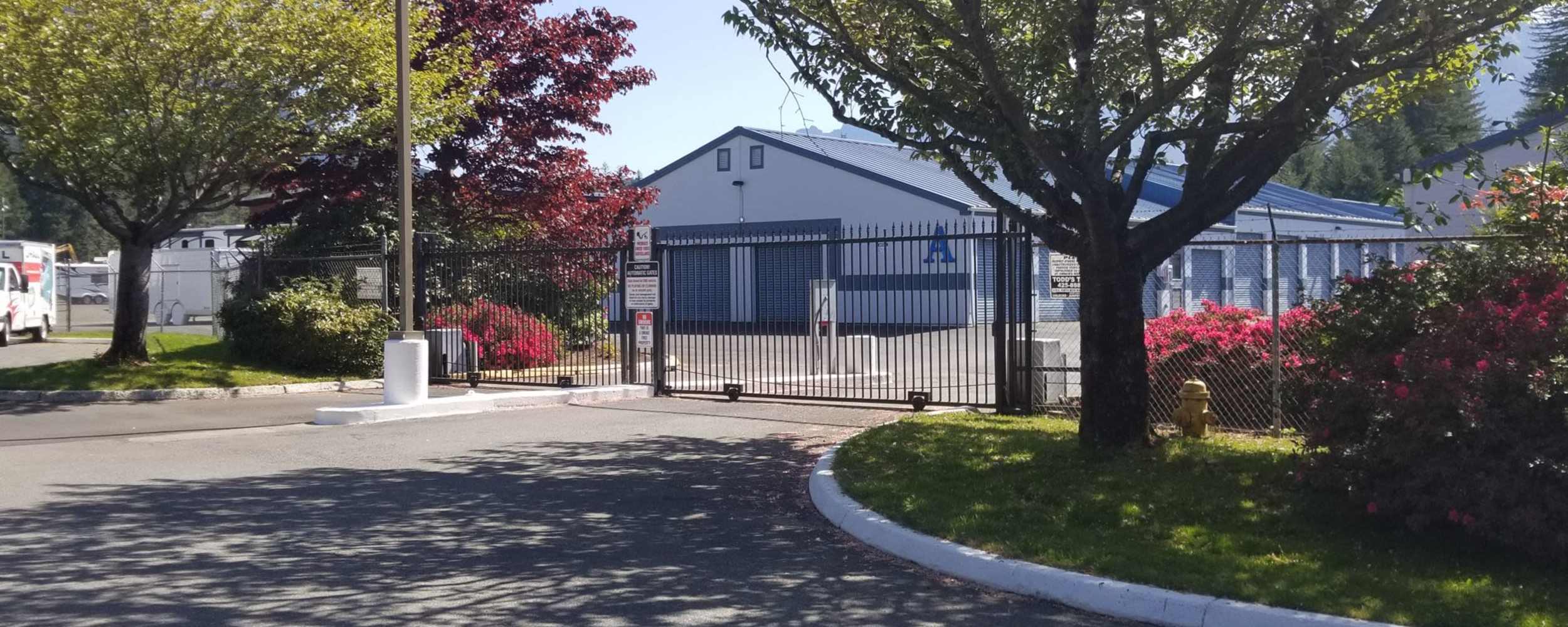 Entrance gate of storage facility at Ole Cedar Mill Mini Storage, North Bend, Washington