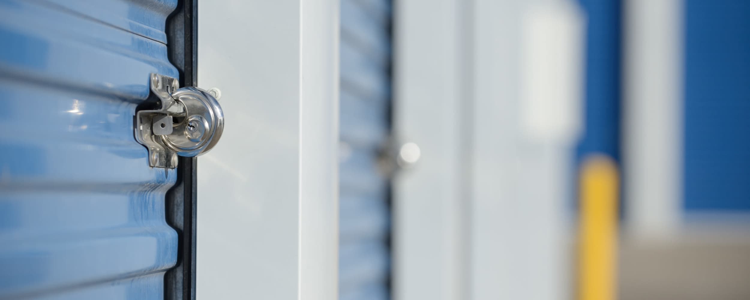 Lock on a blue storage unit door at Centennial Storage in Bonney Lake, Washington