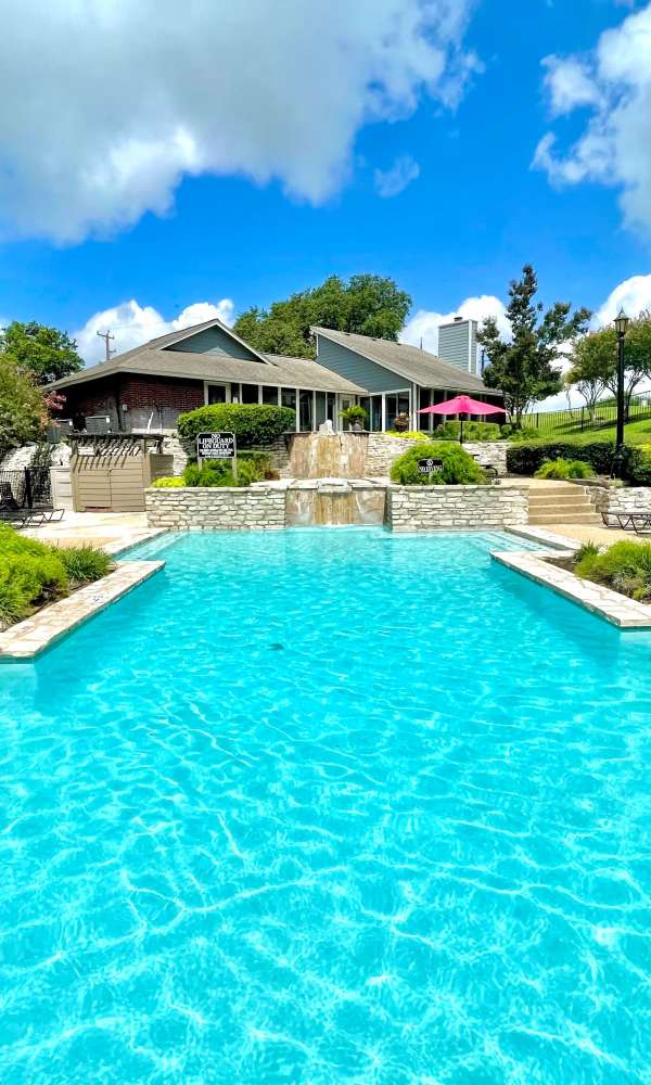 Swimming pool with cascading waterfalls at The Abbey at Medical Center in San Antonio, Texas