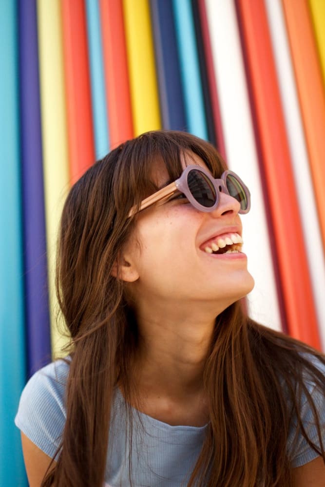 Resident in front of colorful background near Park Place Apartments, Del Mar, California