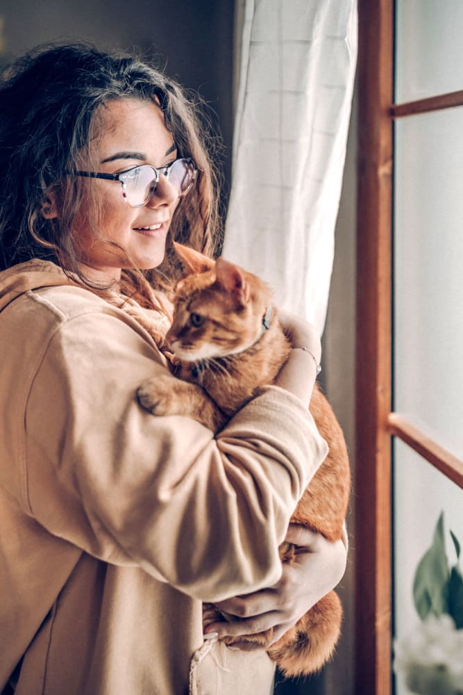 Resident with her cat at Audubon Village in Bridge City, Louisiana