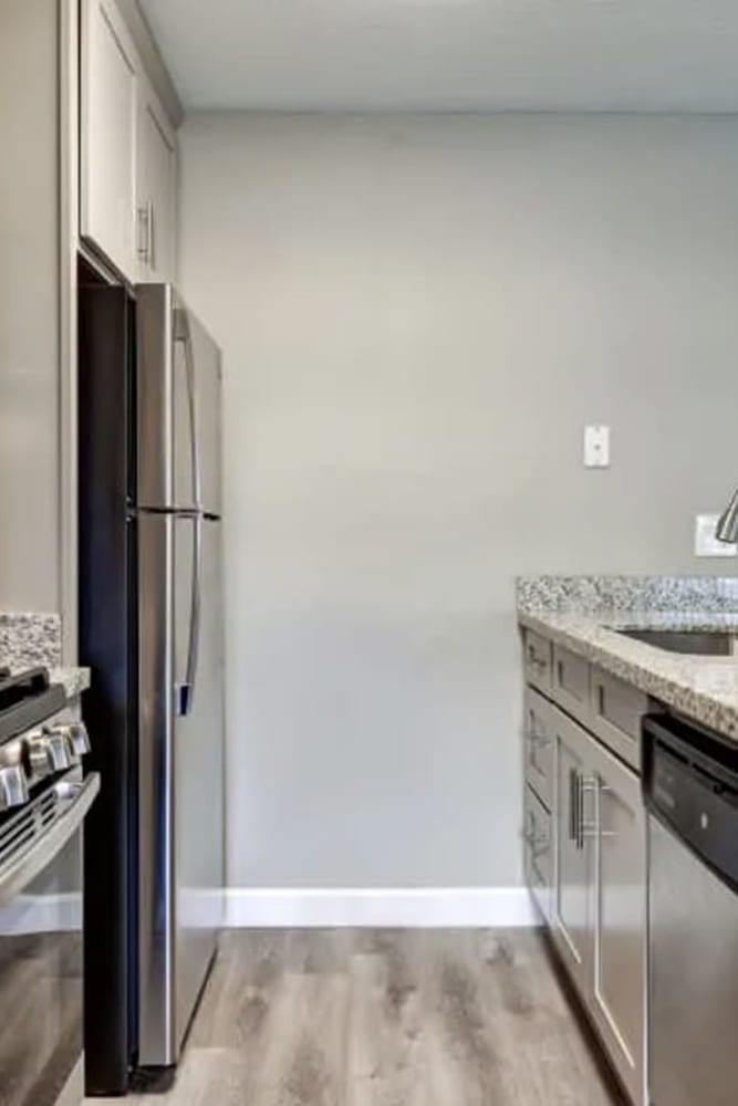 Modern kitchen with stainless-steel appliances at Creekside Gardens in Vacaville, California