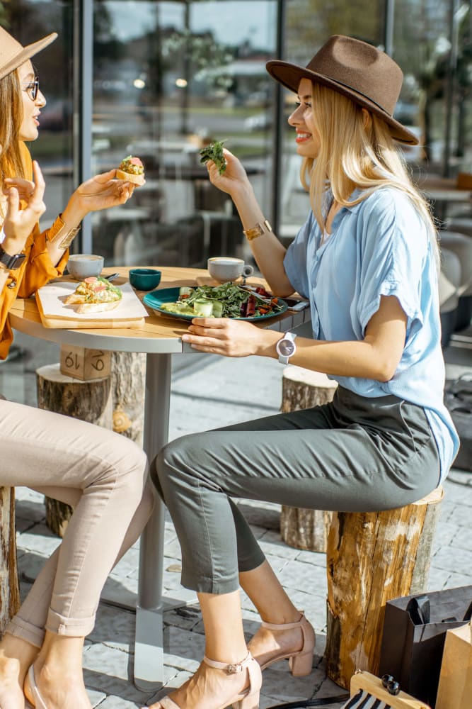 Friends having coffee near Wadsworth Park Apartments in Los Angeles, California