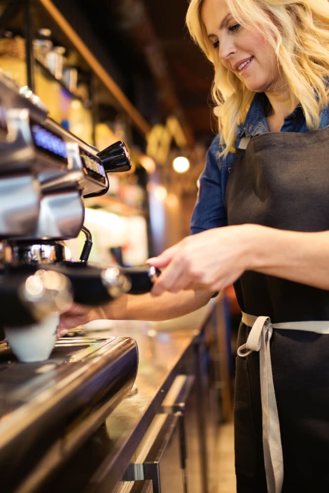 Barista making a drink at a local café near Sun Housing in Shuqualak, Mississippi