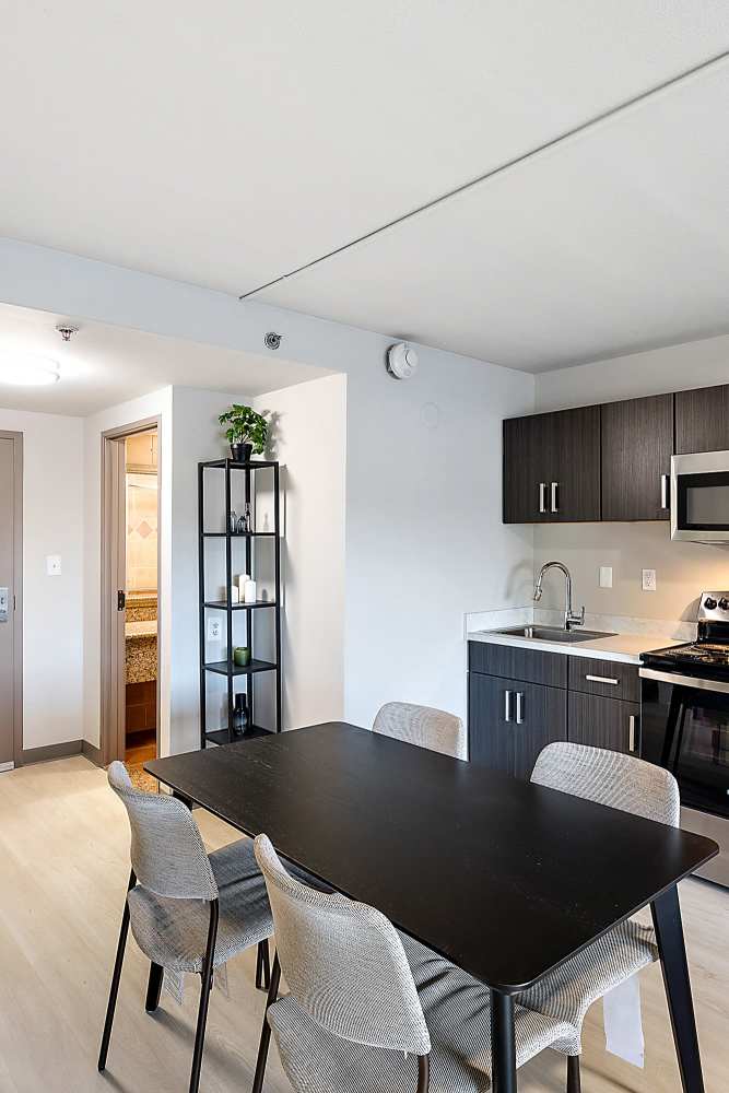 Dining table in a model studio apartment at The Block at Sterling Heights in Sterling Heights, Michigan