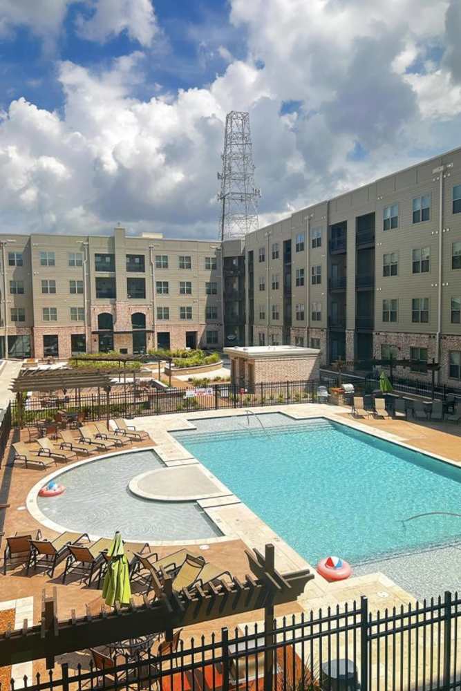 Crystal clear swimming pool at Erdace Apartments in Lake Charles, Louisiana