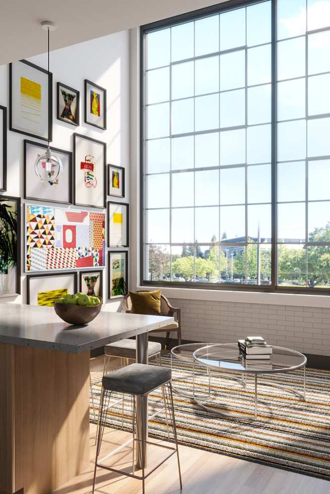 Living room with large size window at Mojud Lofts in Greensboro, North Carolina