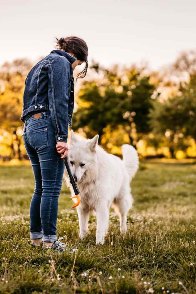 A resident with their pet dog at a park near Flats On Wakefield in San Antonio,Texas