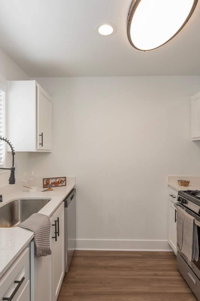 Kitchen with wood flooring at Ava Apartments in Rocklin, California
