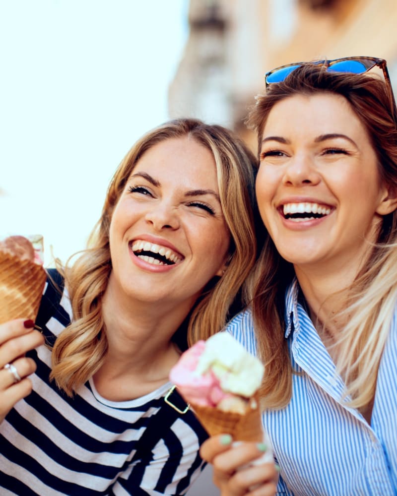 Women enjoying some tasty ice cream cones near The Quarry Townhomes in San Antonio, Texas