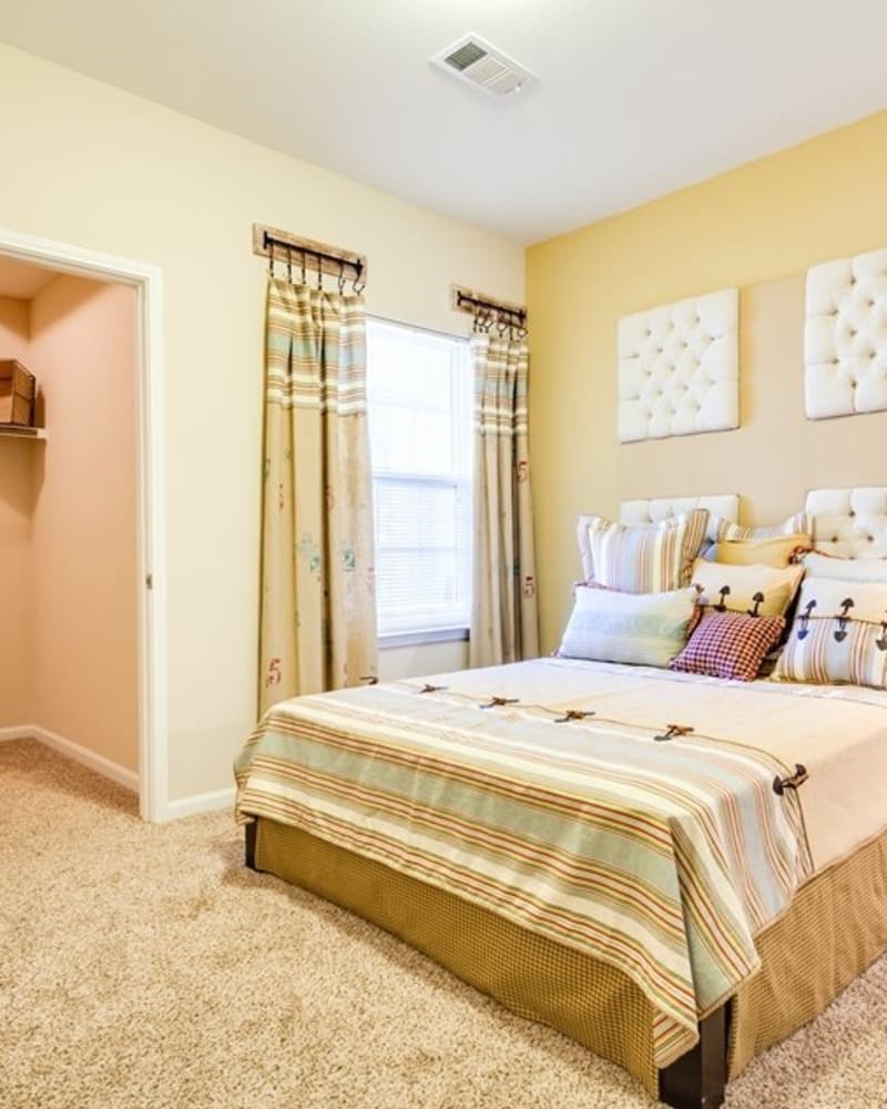 Carpeted bedroom at Evergreen at The Bluffs in Knoxville, Tennessee