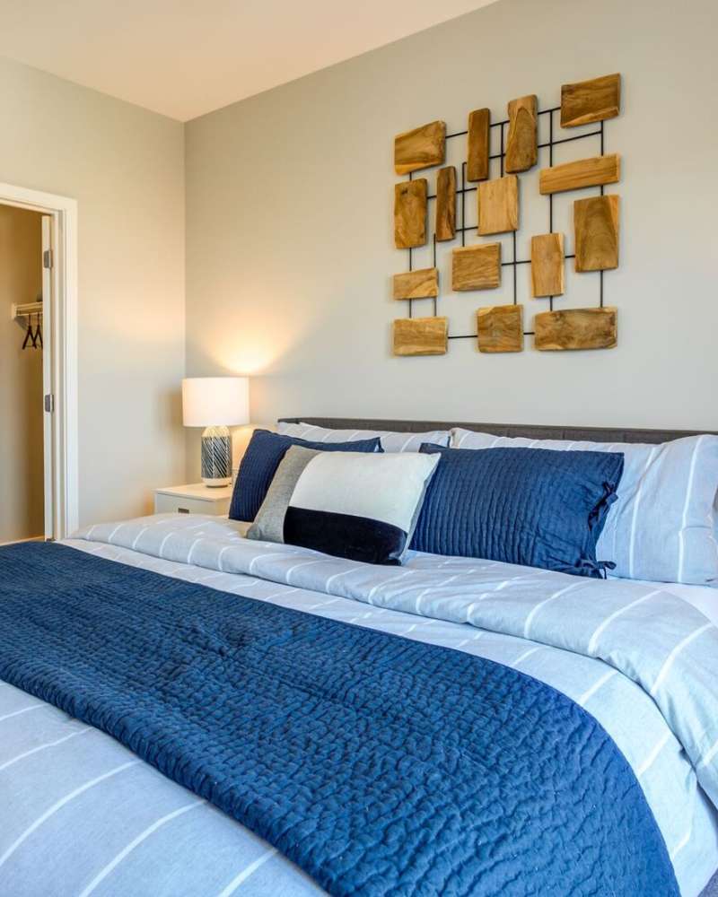 Living room with modern furniture at Maple and Main Apartments in Downers Grove, IL