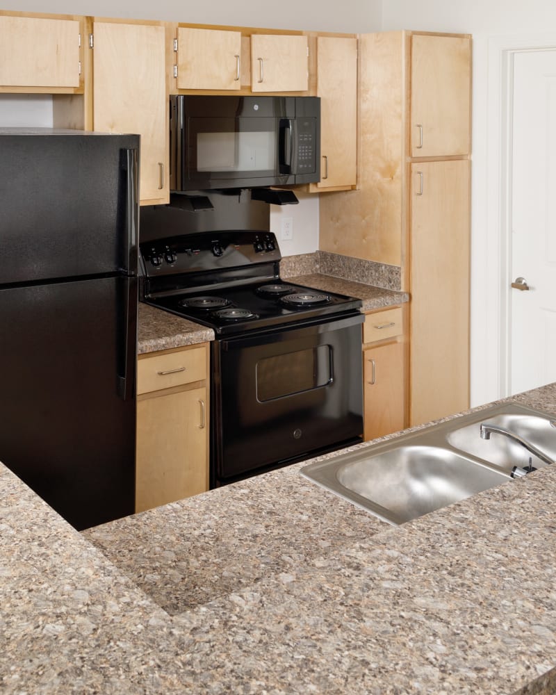 An apartment kitchen at Magnolia Heights in Covington, Georgia