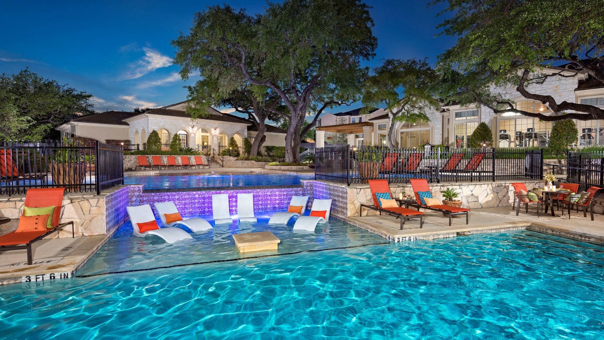 A luxury pool with lounge chairs at a Management Support community