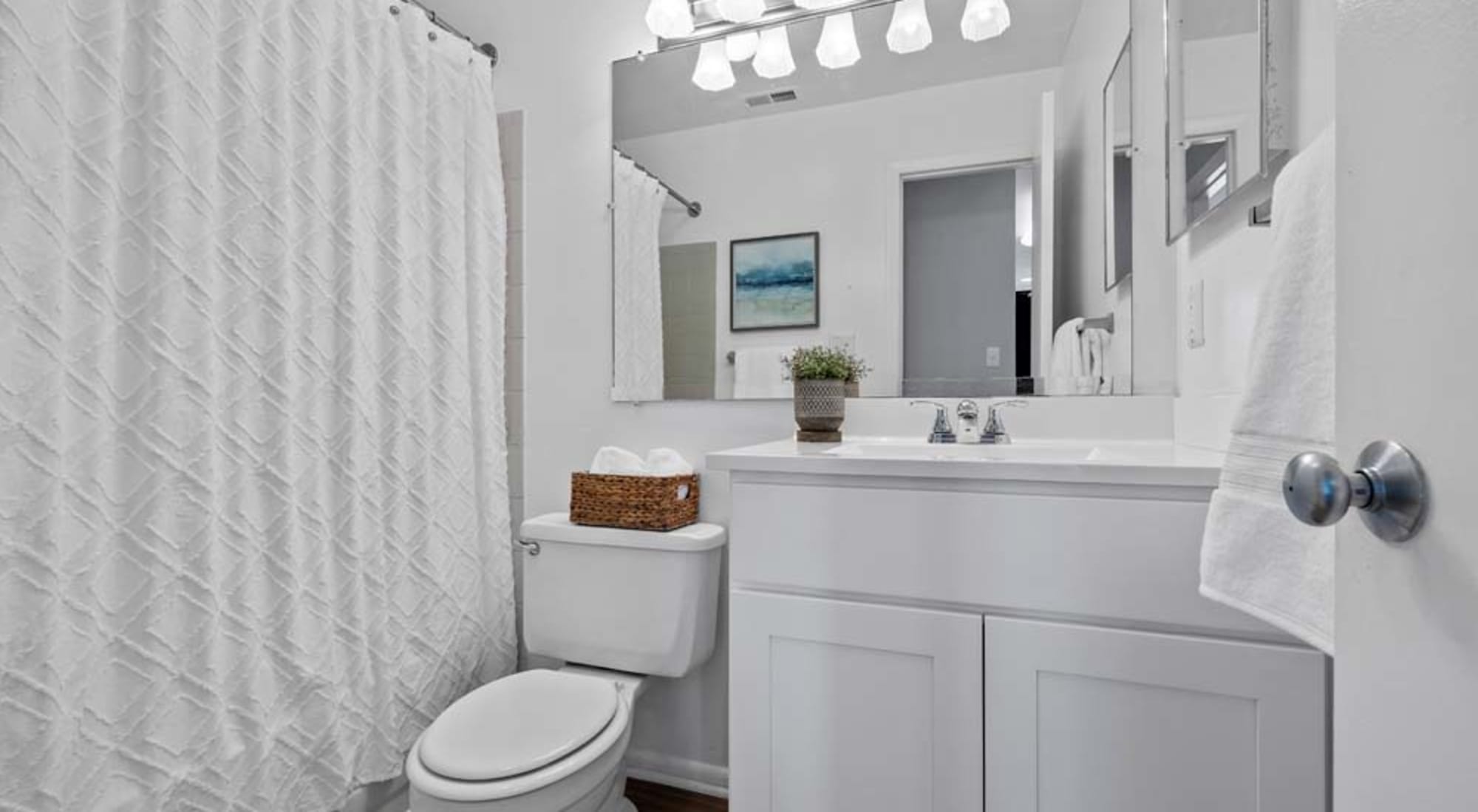 Modern model bathroom at Runaway Bay Apartments in Virginia Beach, Virginia