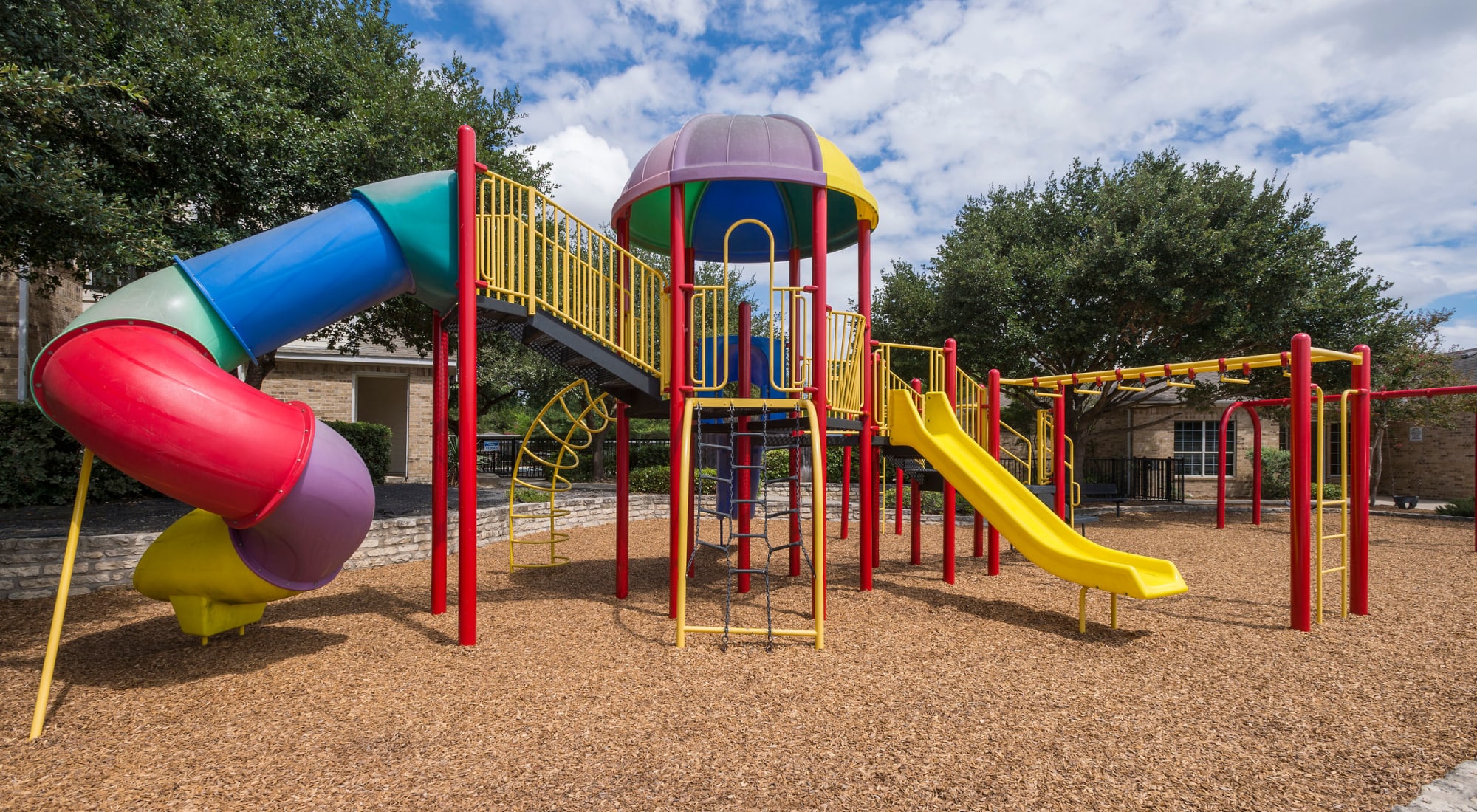 Playground with slides at Stoneybrook Apartments & Townhomes