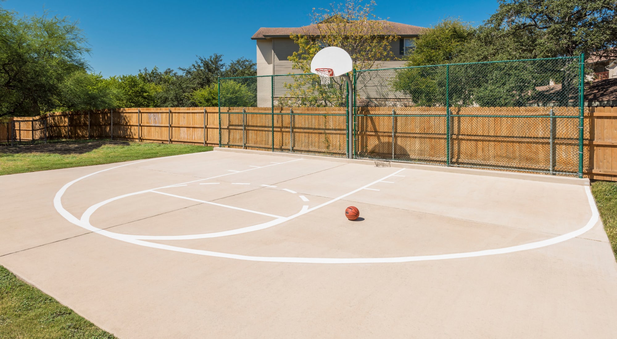 Outdoor basketball court at The Estates of Northwoods
