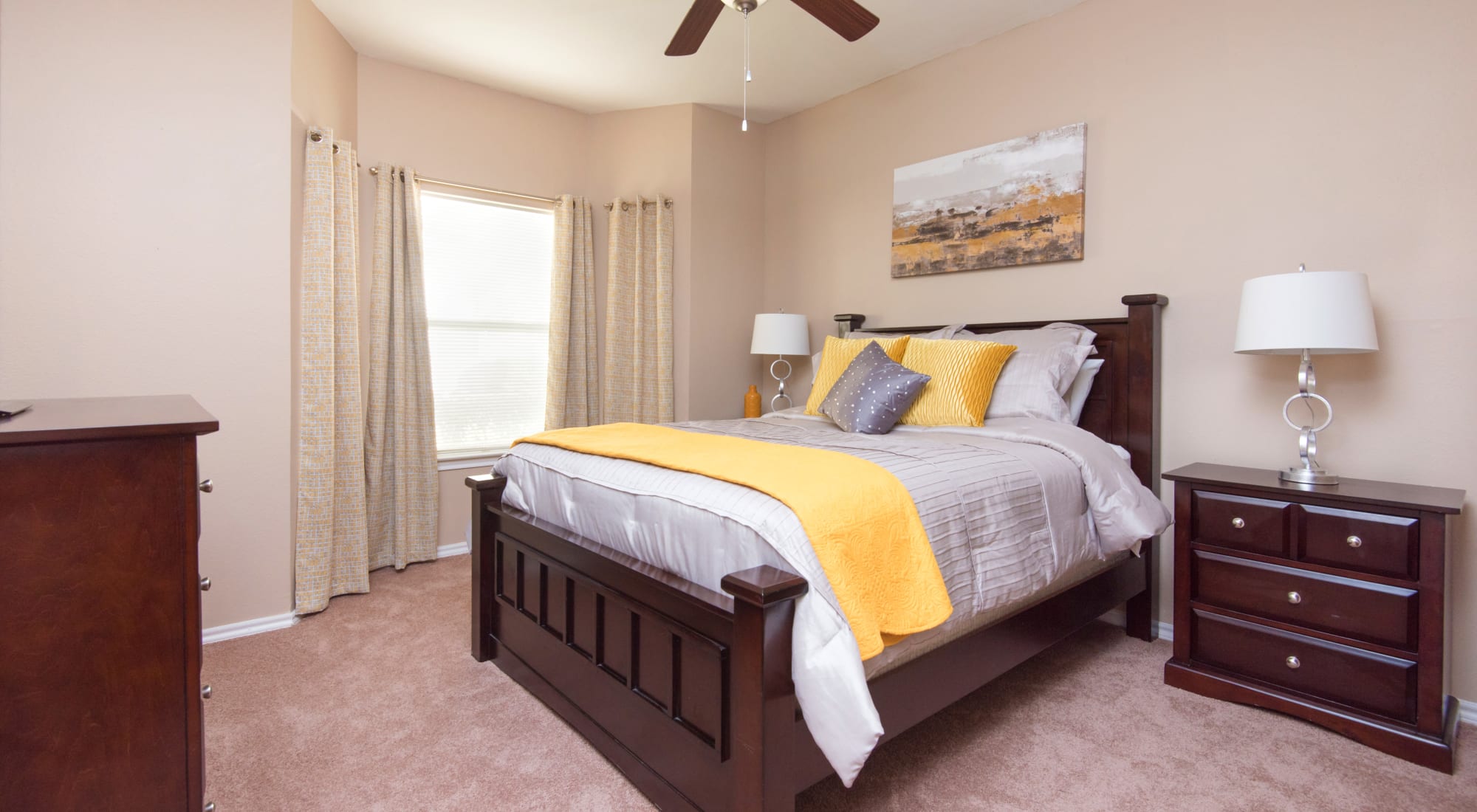 Bedroom with ceiling fan at Villas of Preston Creek