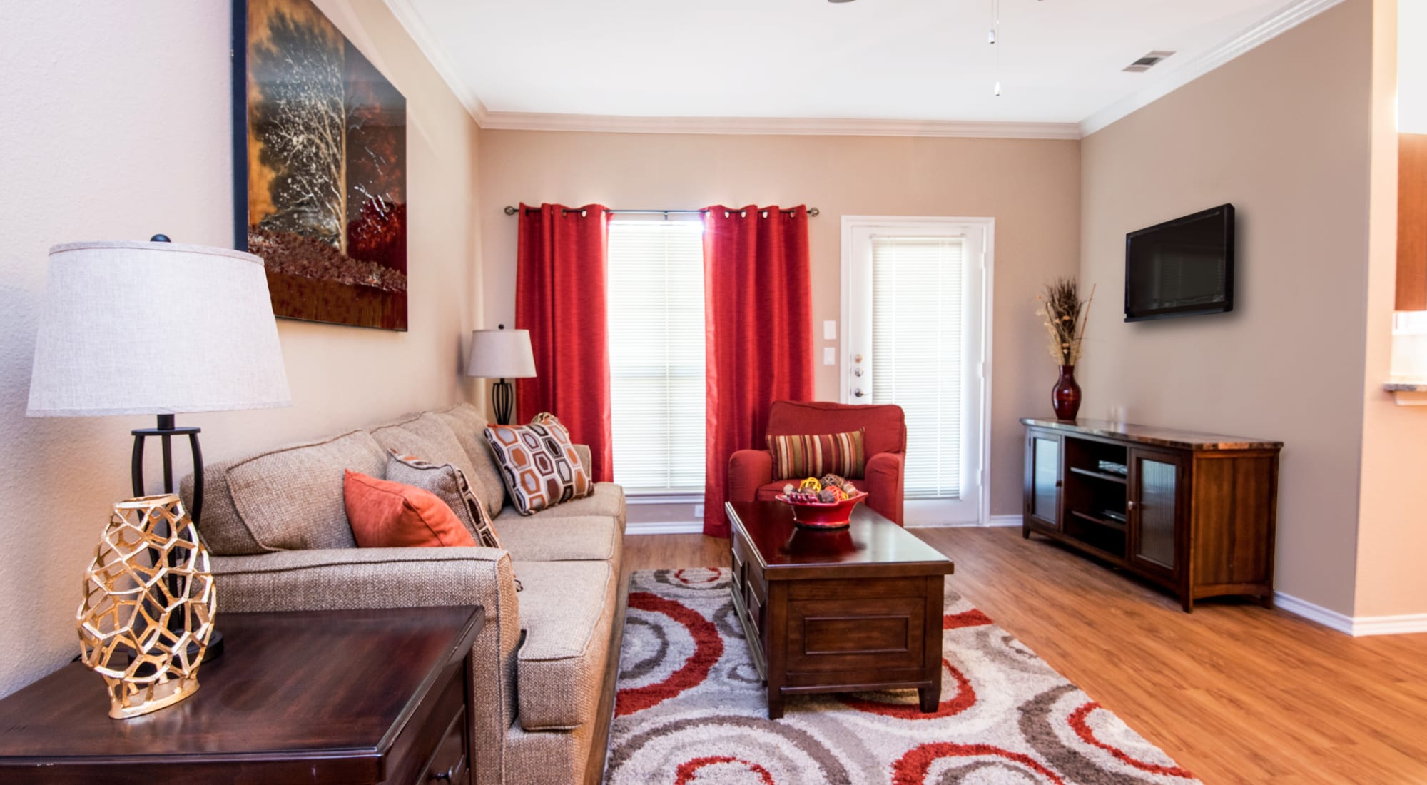 Living room with ceiling fan at Villas of Preston Creek