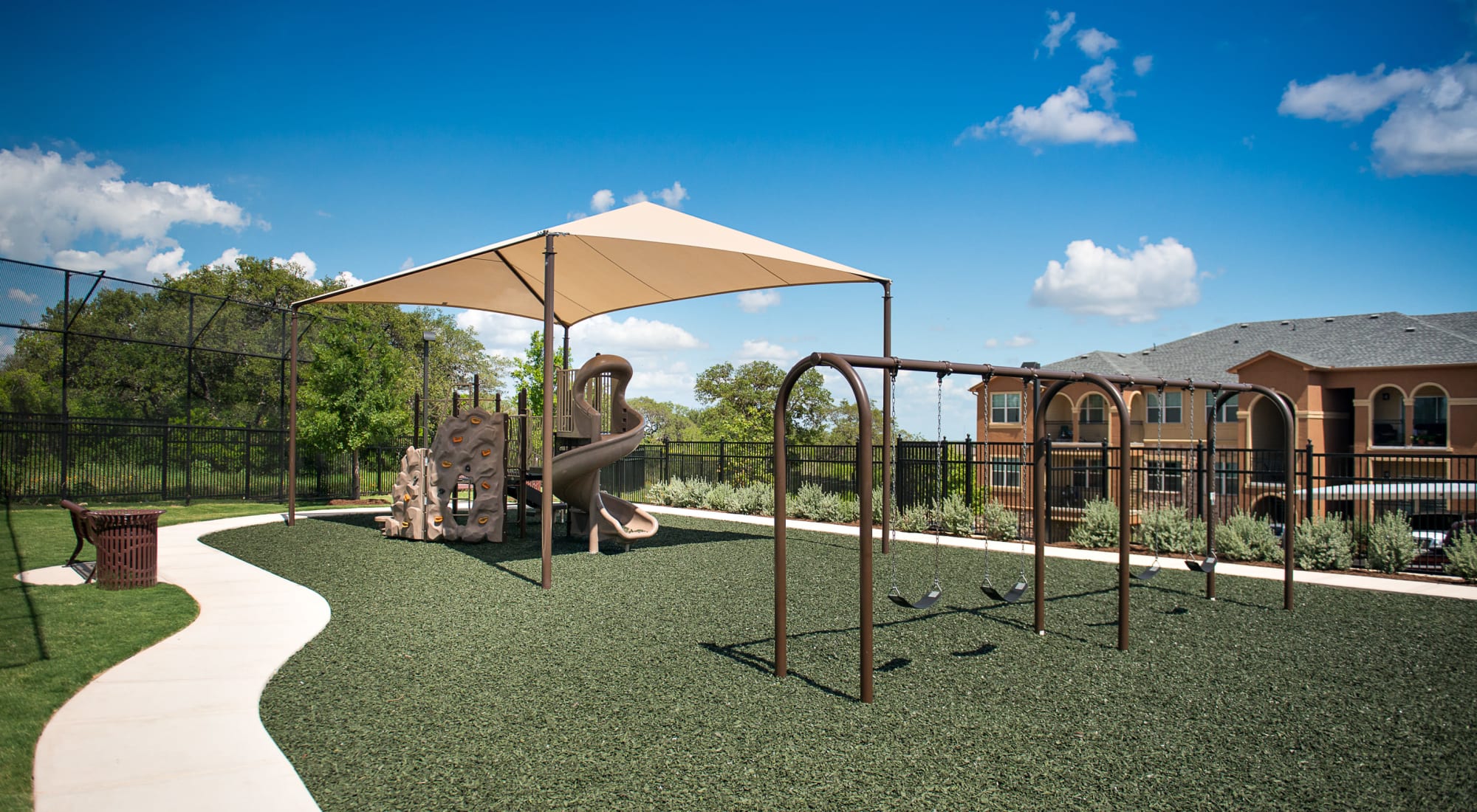Playground with Shade Sail at Villas in Westover Hills