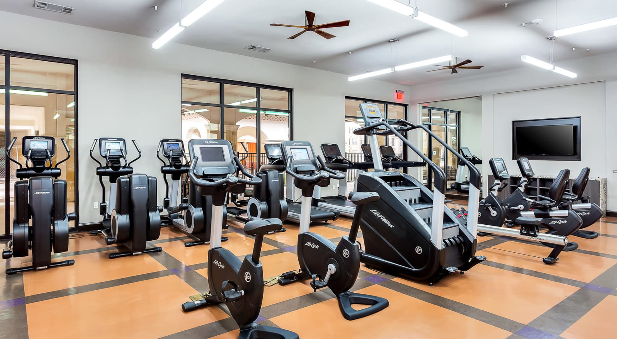 Cardio machines in the fitness area at Villas at the Rim in San Antonio, Texas