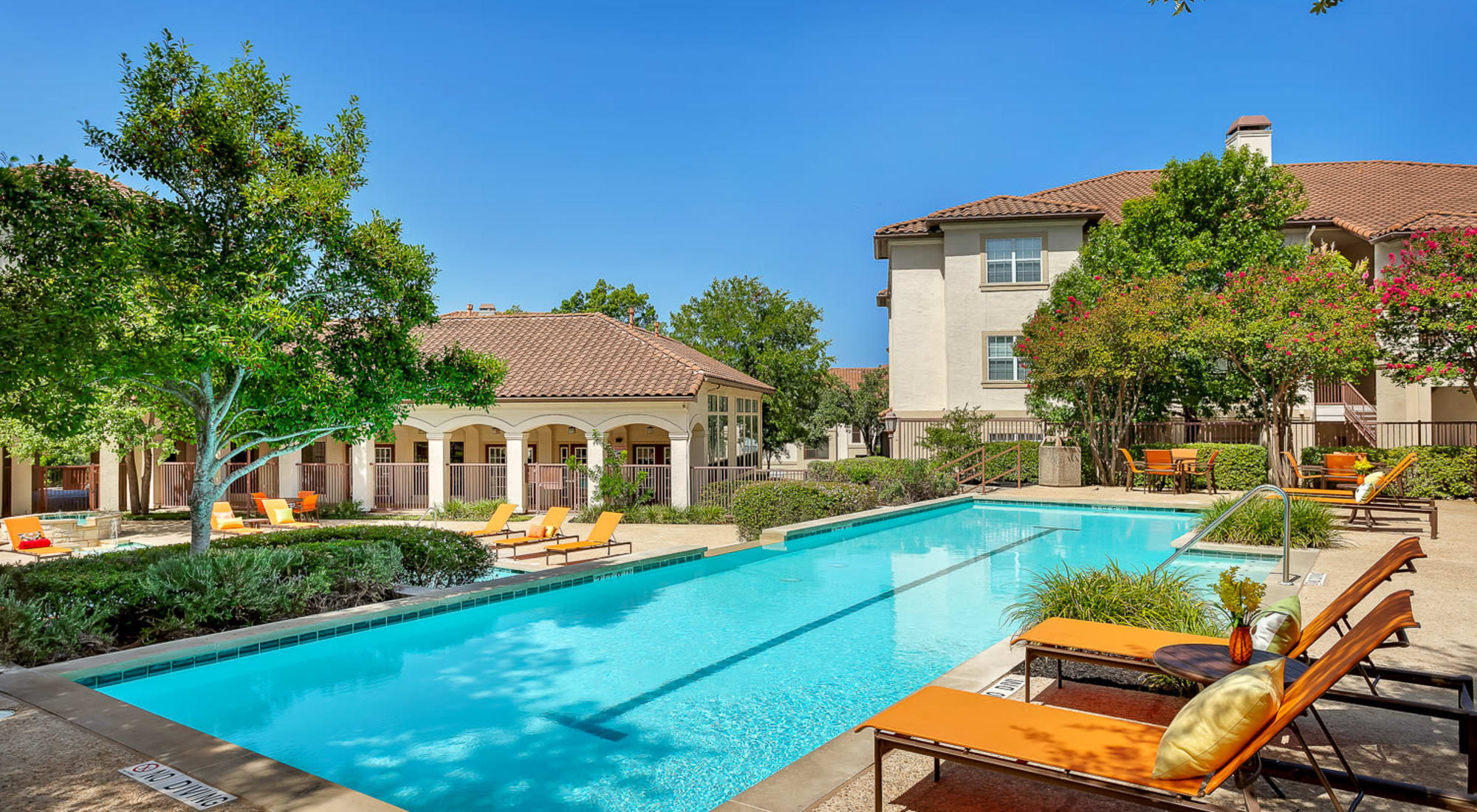 Swimming pool with lounge chairs at Mira Vista at La Cantera 