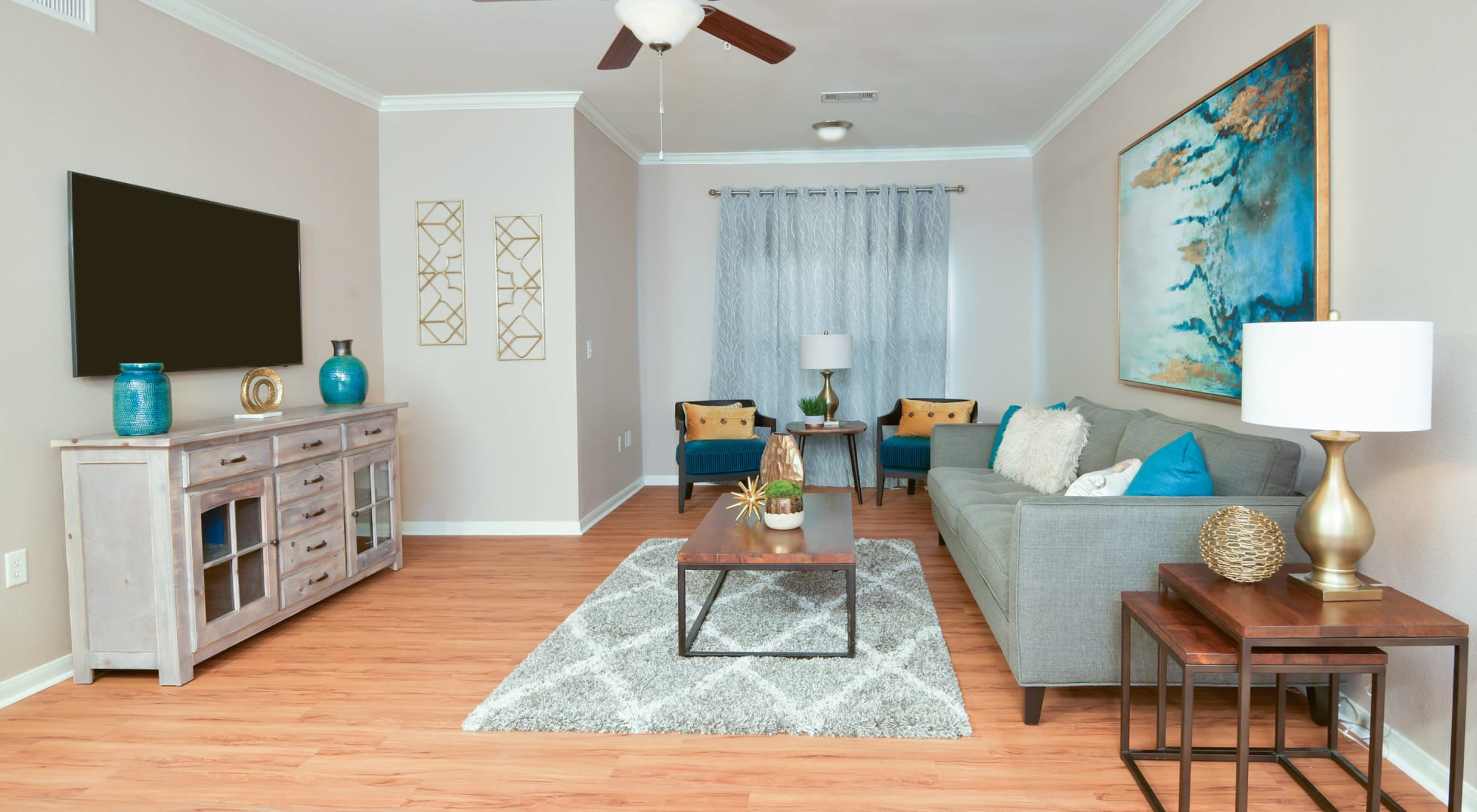 Living room with fan at Estancia at Ridgeview Ranch in Plano, Texas