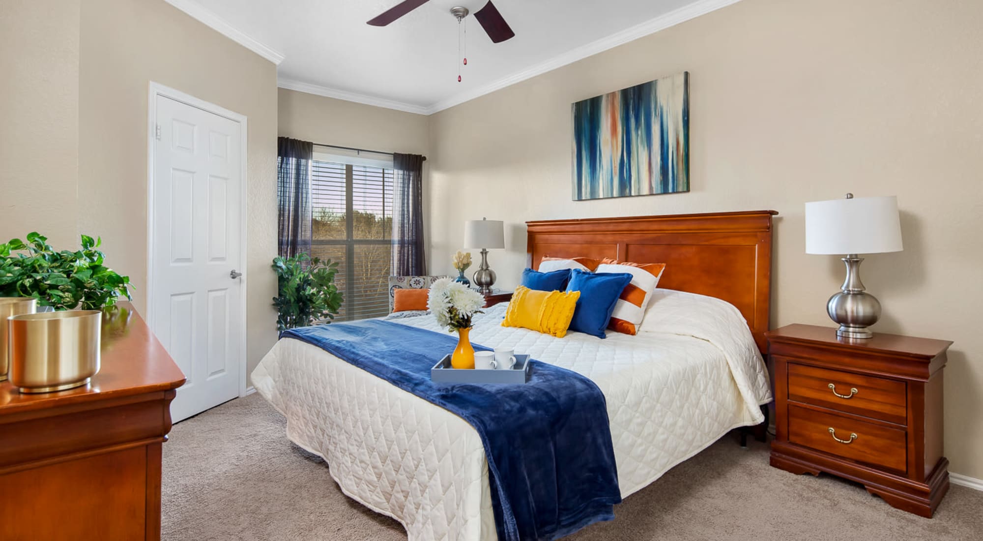 Bedroom with ceiling fan at Villas at Oakwell Farms