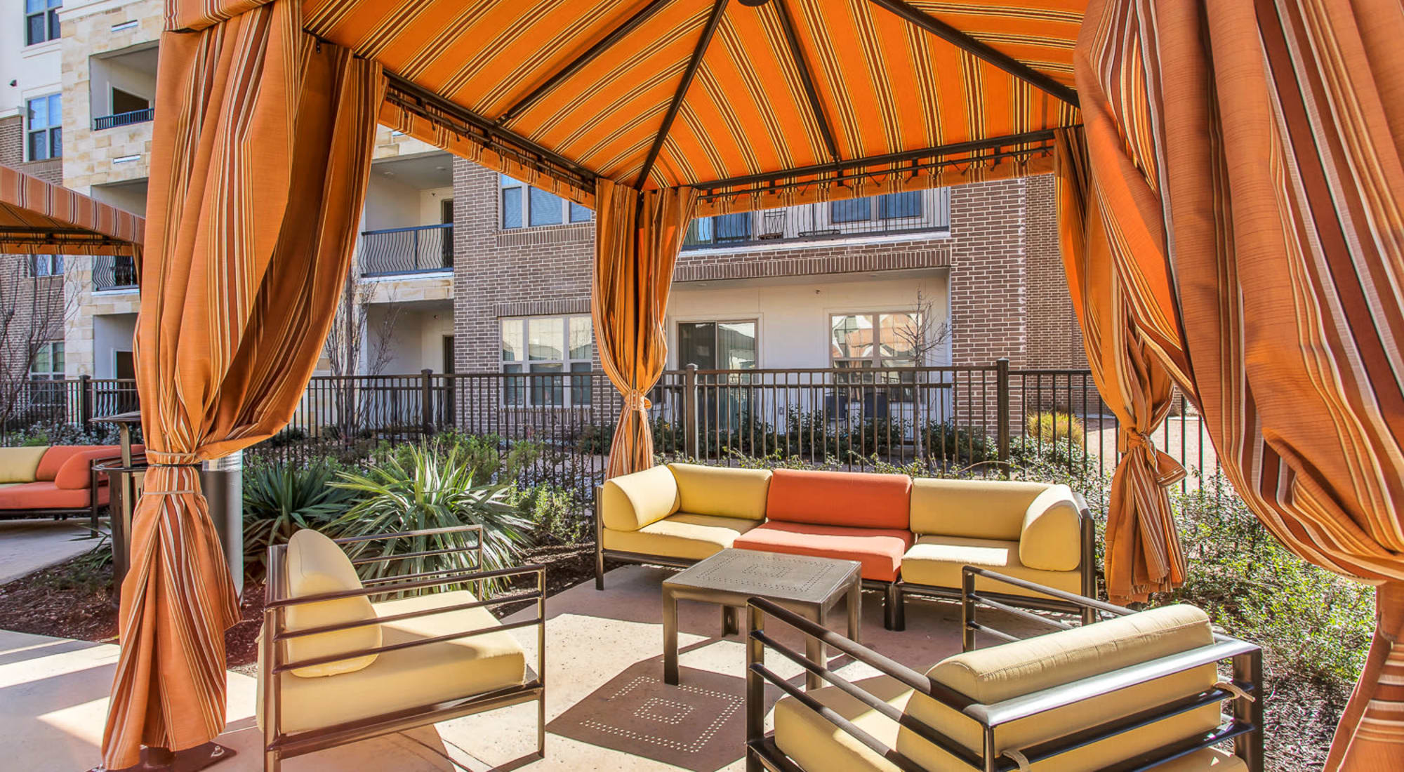 Covered cabanas by the pool at Villas at the Rim in San Antonio, Texas