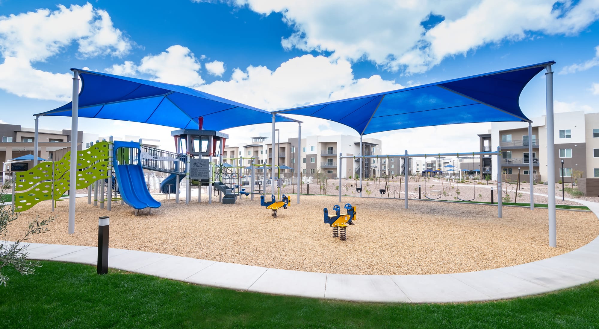 Building exterior and community pool at Sky at Chandler Airpark in Chandler, Arizona