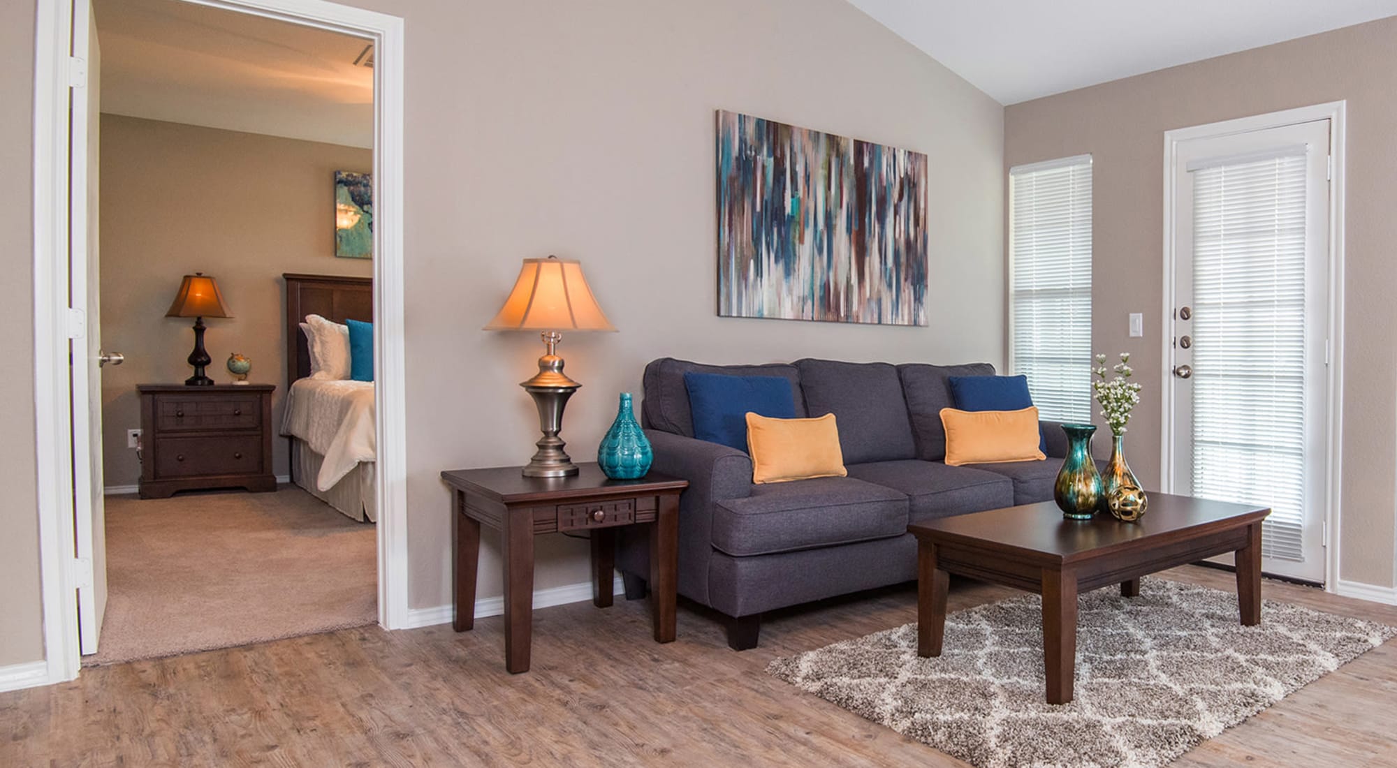 Living Room and Bedroom view at Carrollton Park of North Dallas