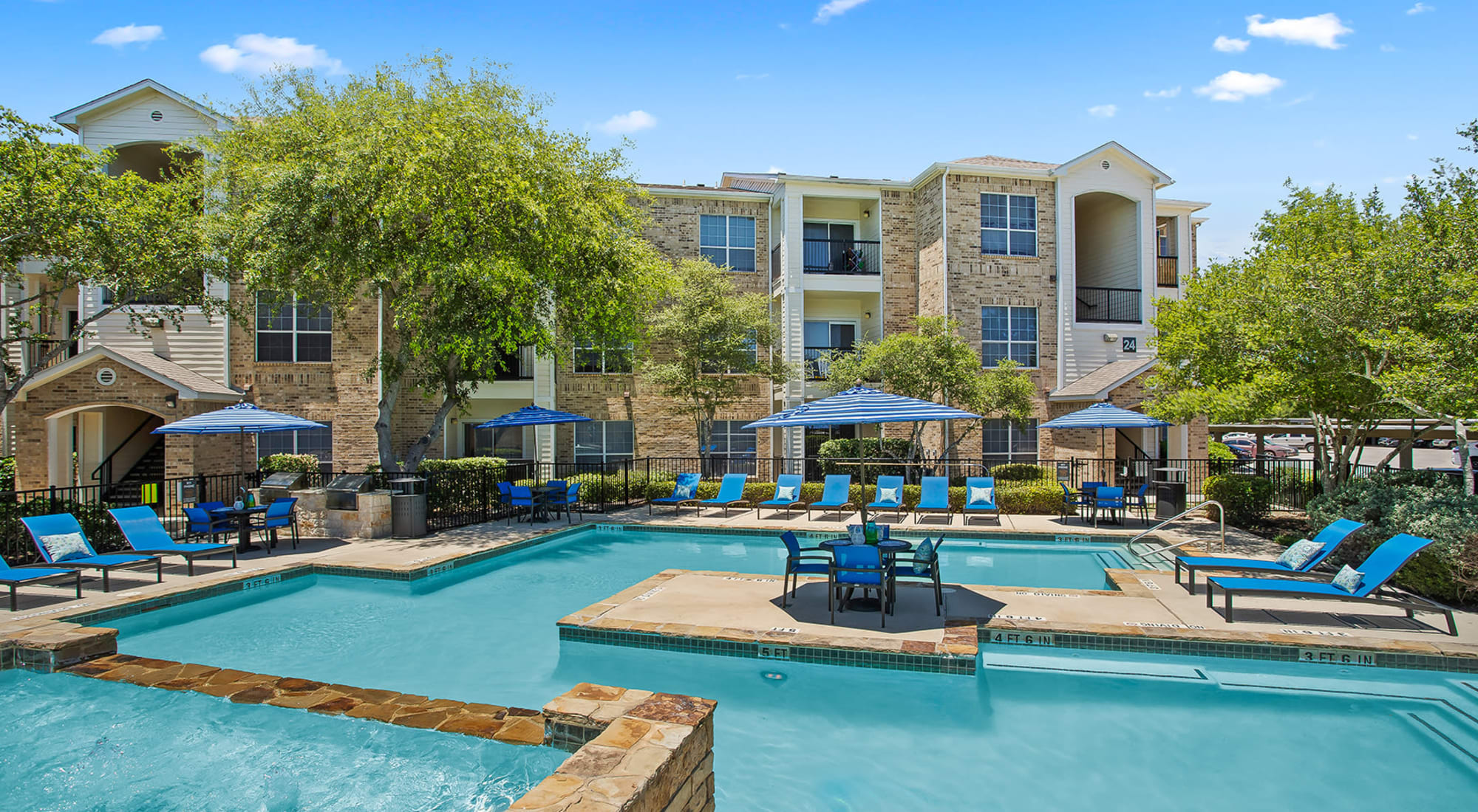 Outdoor community pool at Stoneybrook Apartments & Townhomes in San Antonio, Texas