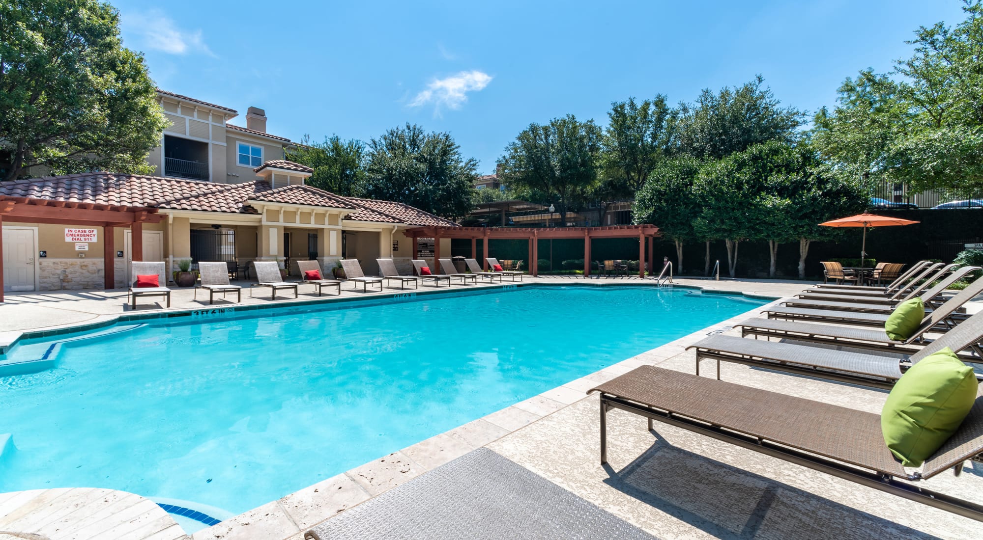 Pool with lounge chairs at Estancia at Ridgeview Ranch