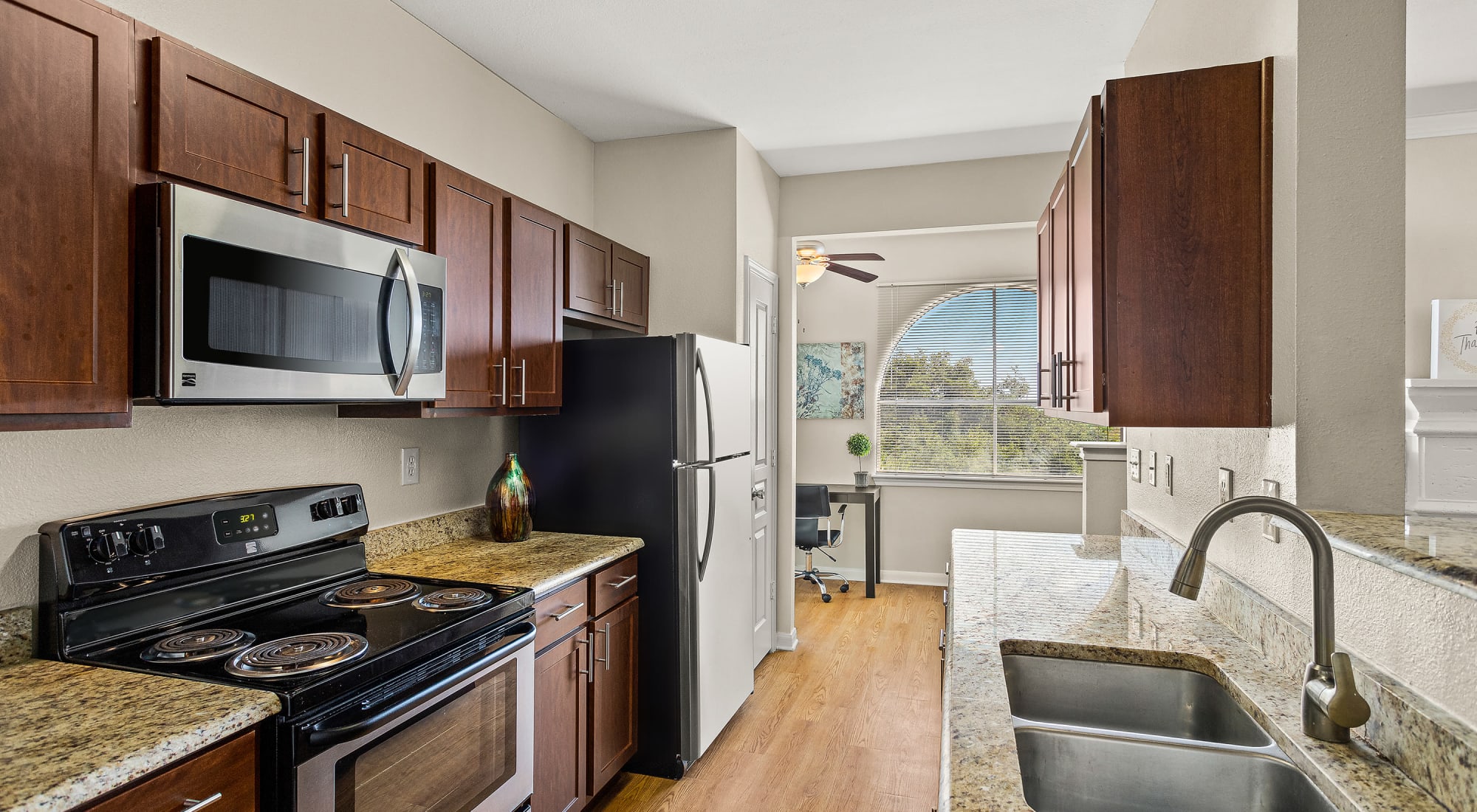 Kitchen with stainless steel appliances at Sedona Ranch