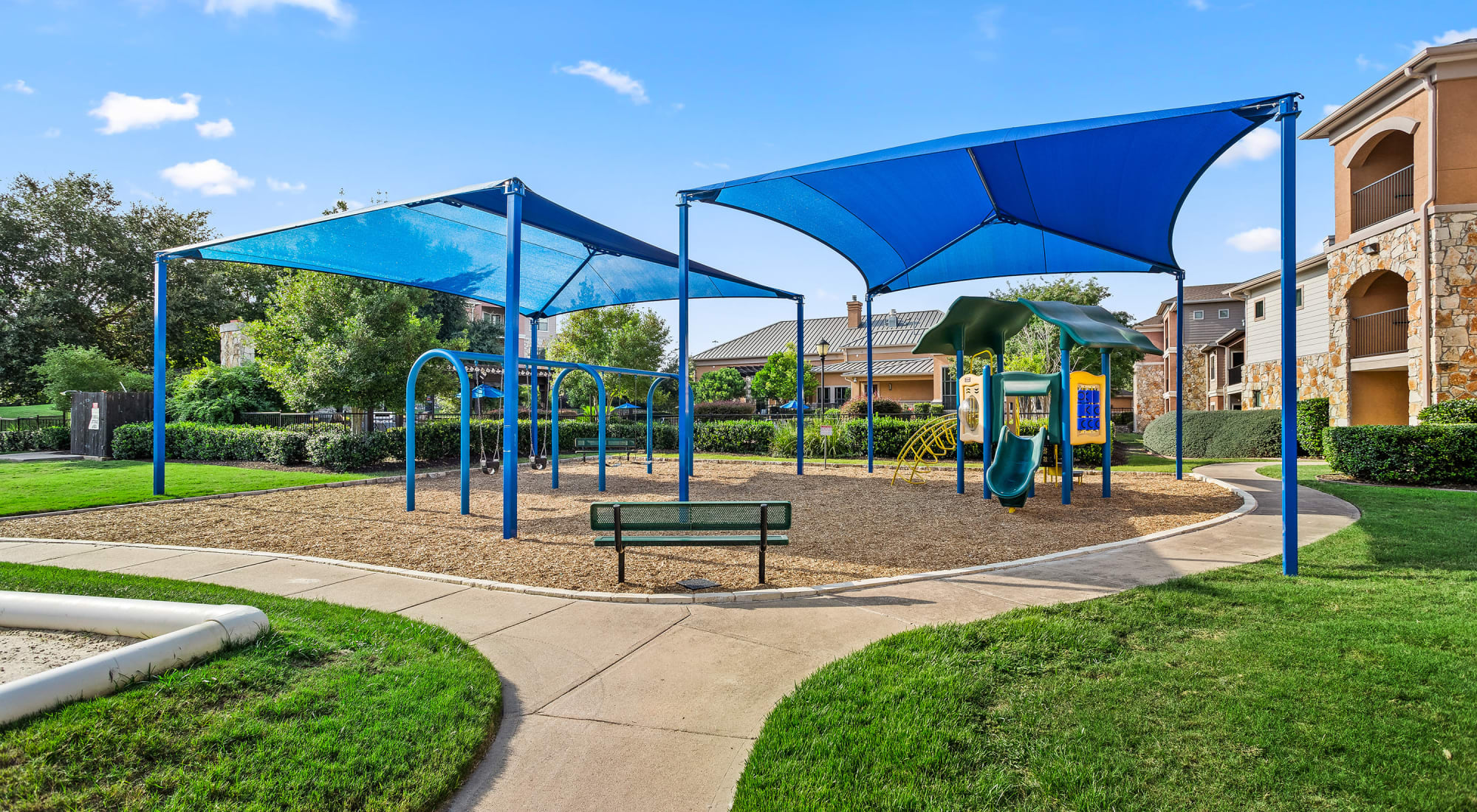 Shaded playground at Onion Creek Luxury Apartments