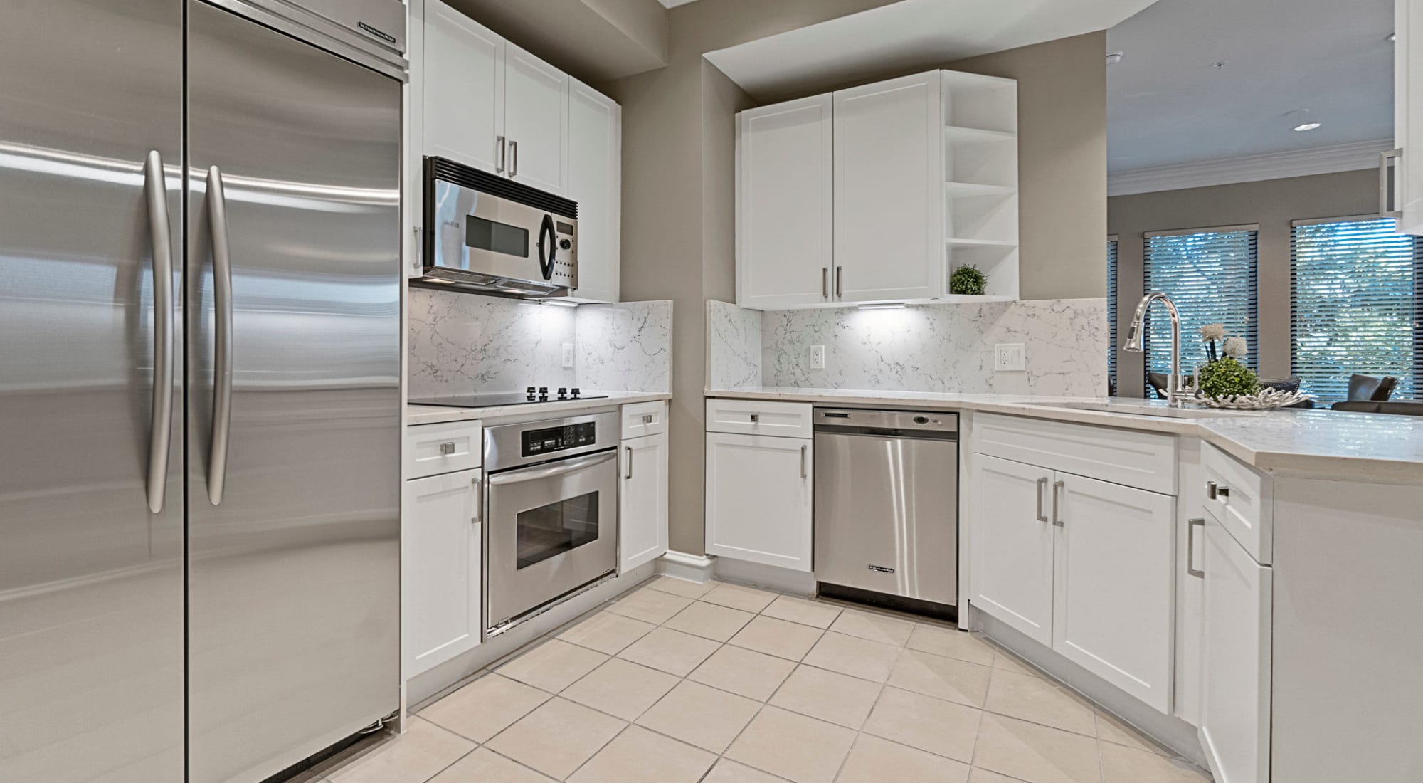 An updated kitchen at Rienzi at Turtle Creek Apartments in Dallas, Texas