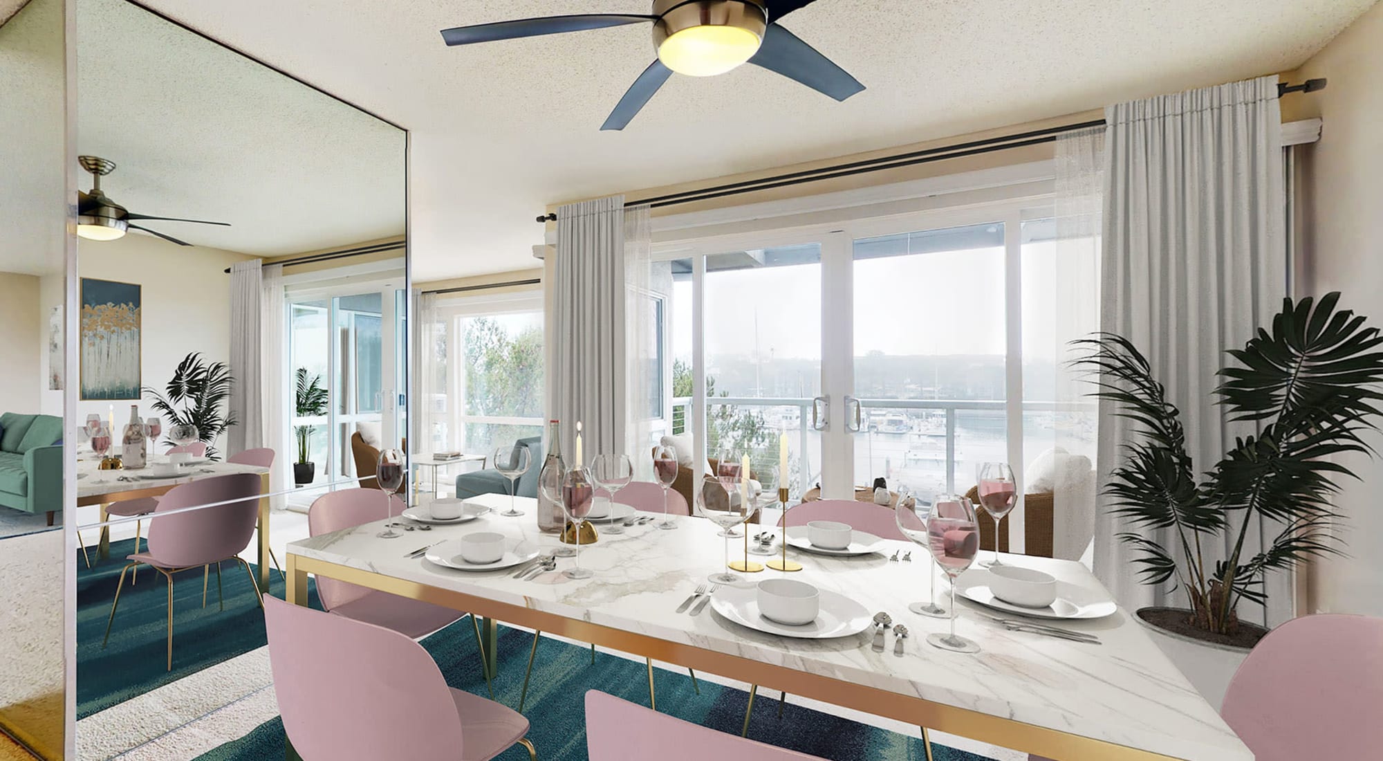 Stylish dining room with expansive waterfront view and balcony in a spacious apartment home at The Tides at Marina Harbor in Marina del Rey, California