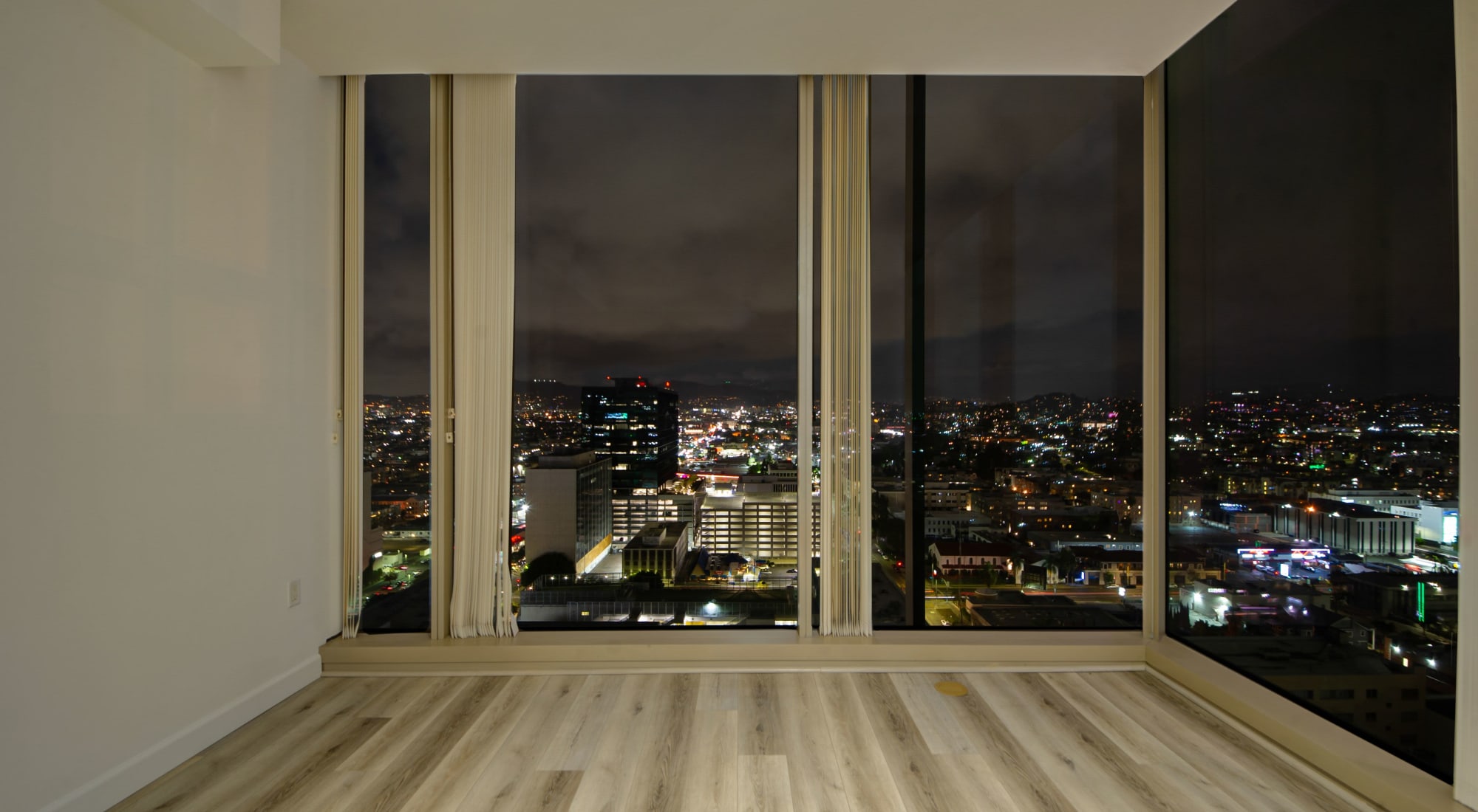 Wood-style flooring and floor to ceiling windows at The Vermont in Los Angeles, California