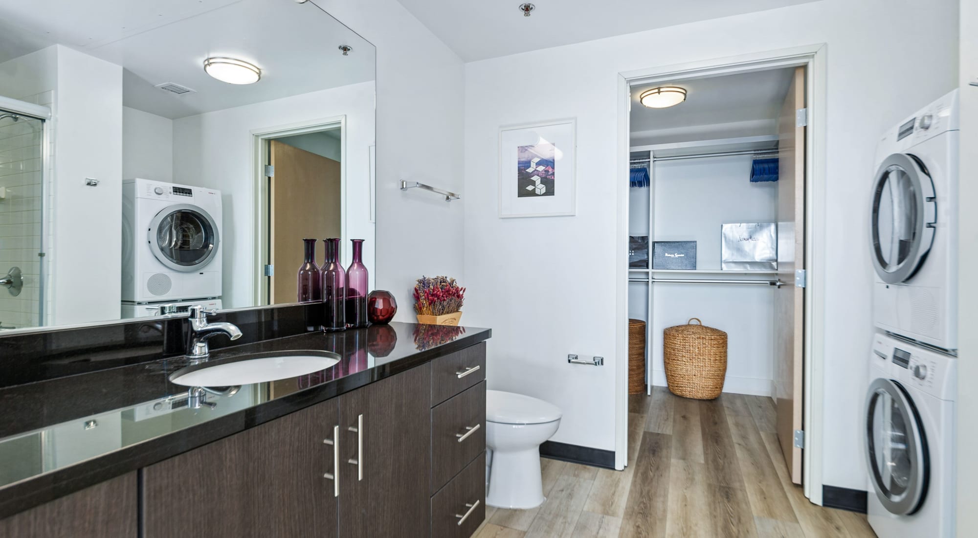Bathroom with washer and dryer at The Vermont in Los Angeles, California