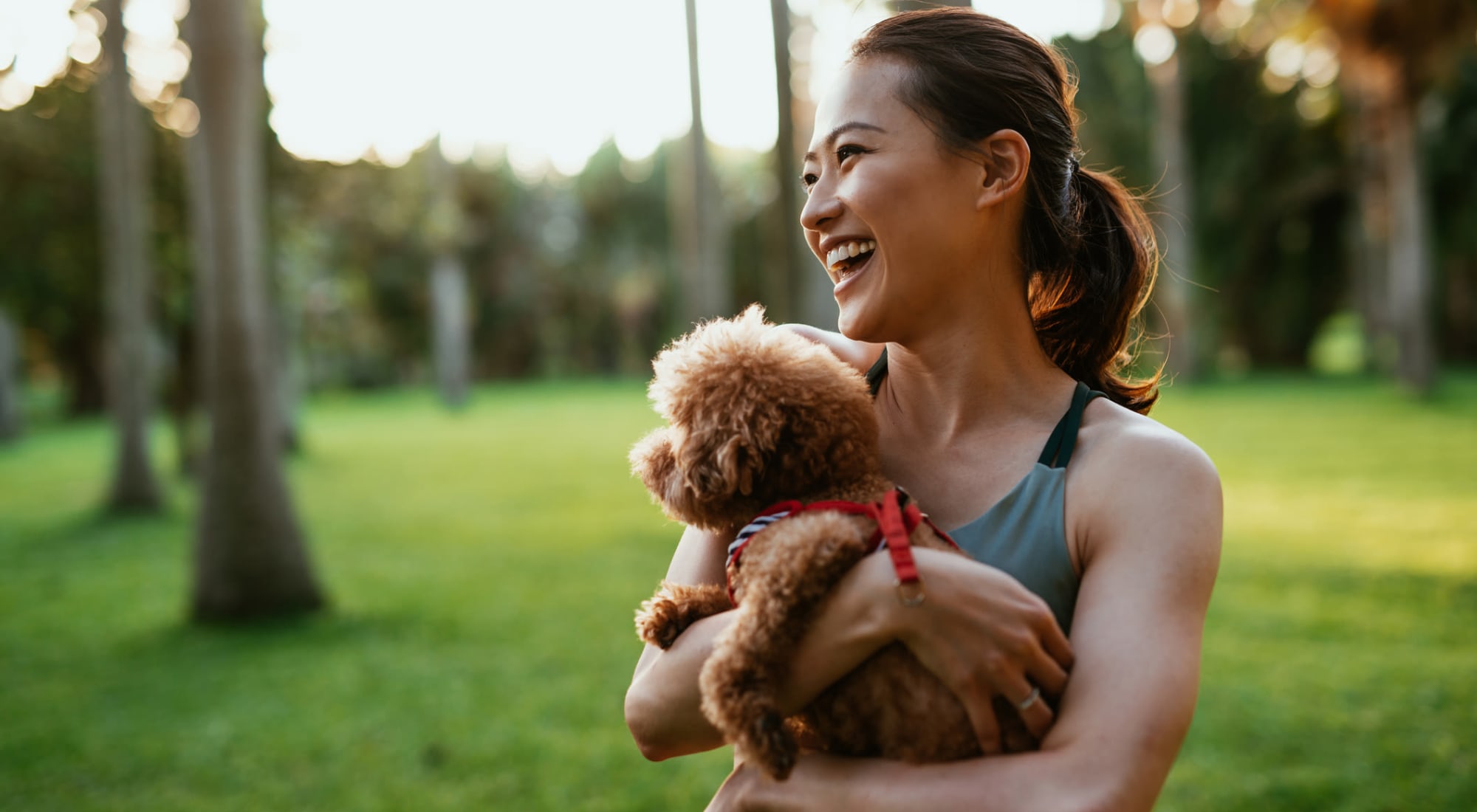 A resident holding their dog at Mariner's Pointe, Joppatowne, Maryland