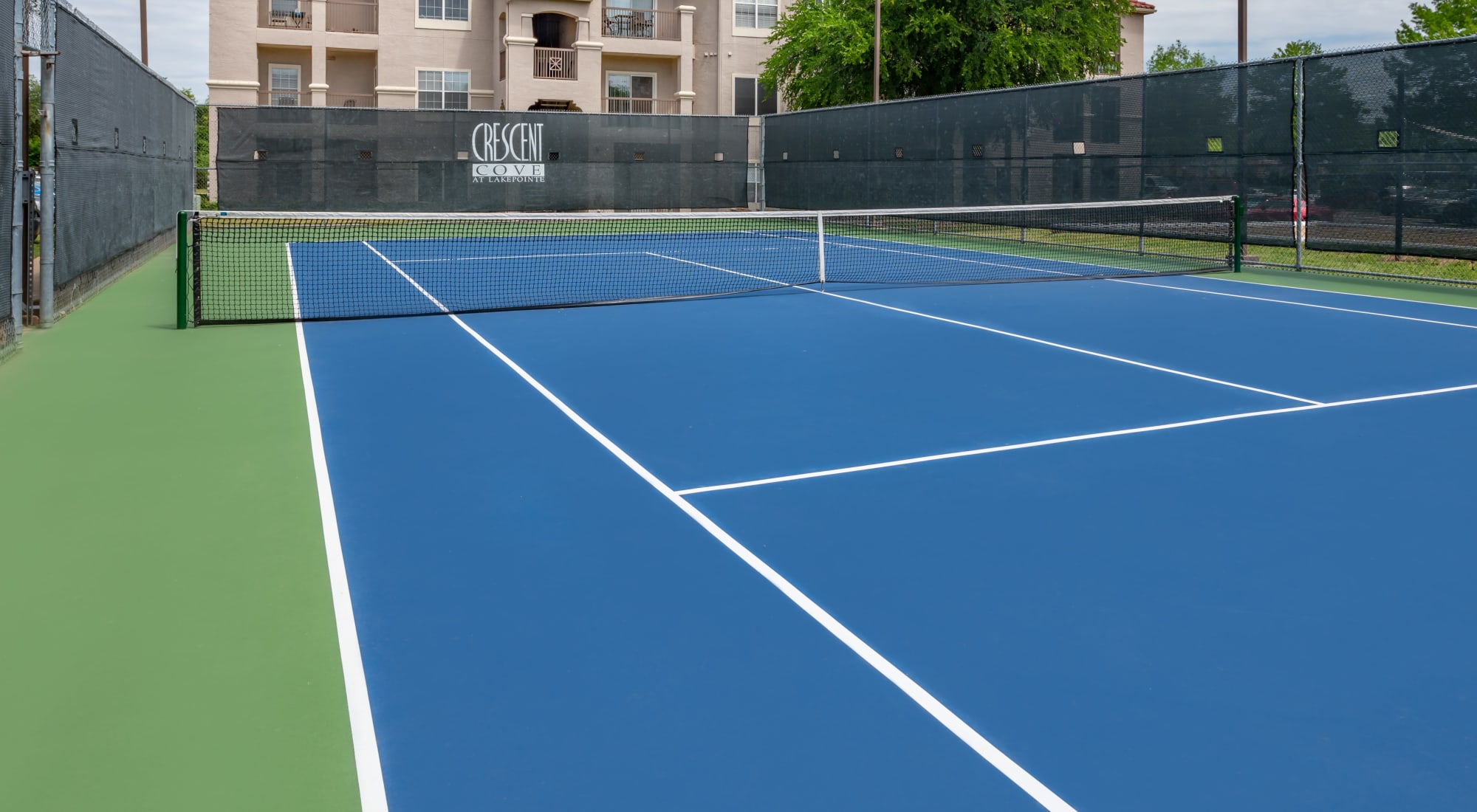 Lighted tennis court at Crescent Cove at Lakepointe 