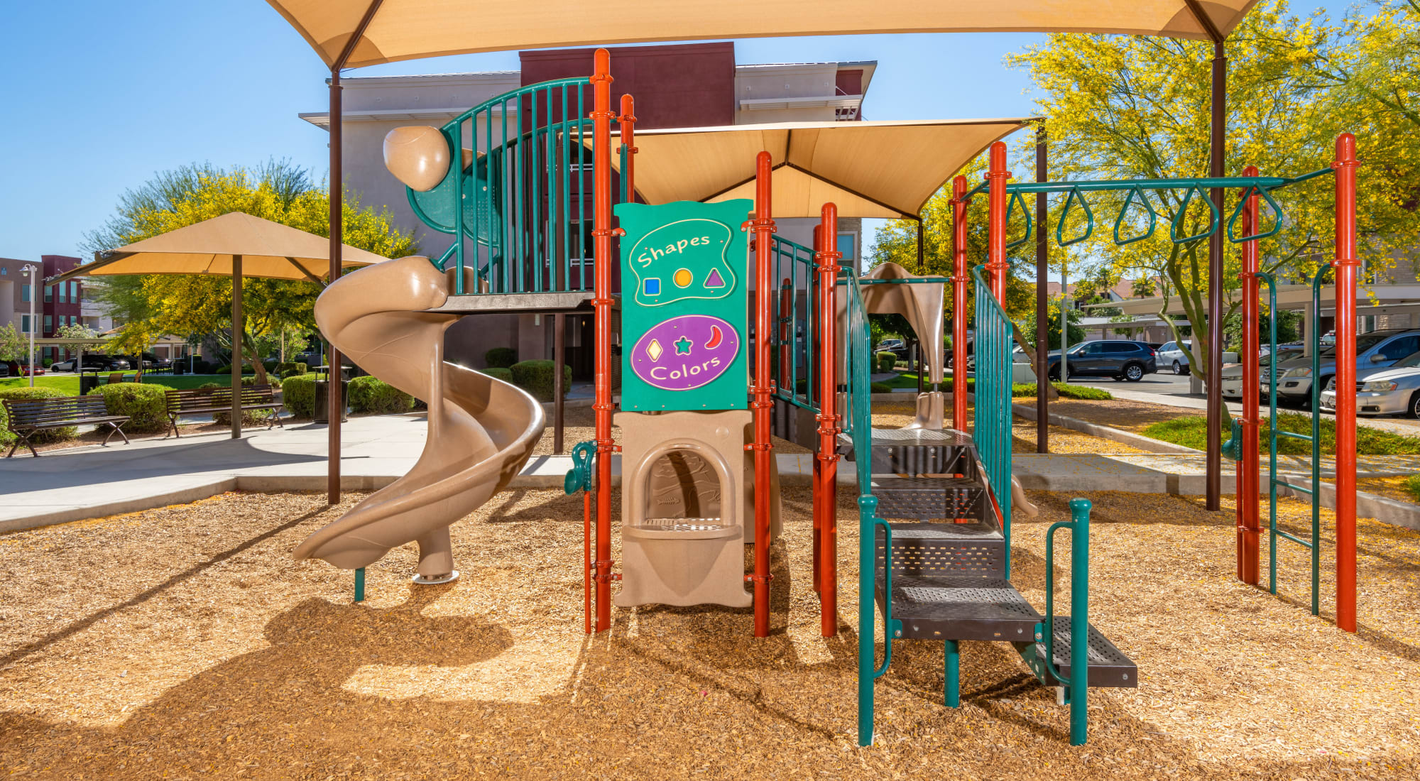 Playground with Shade Sail at Southern Avenue Villas