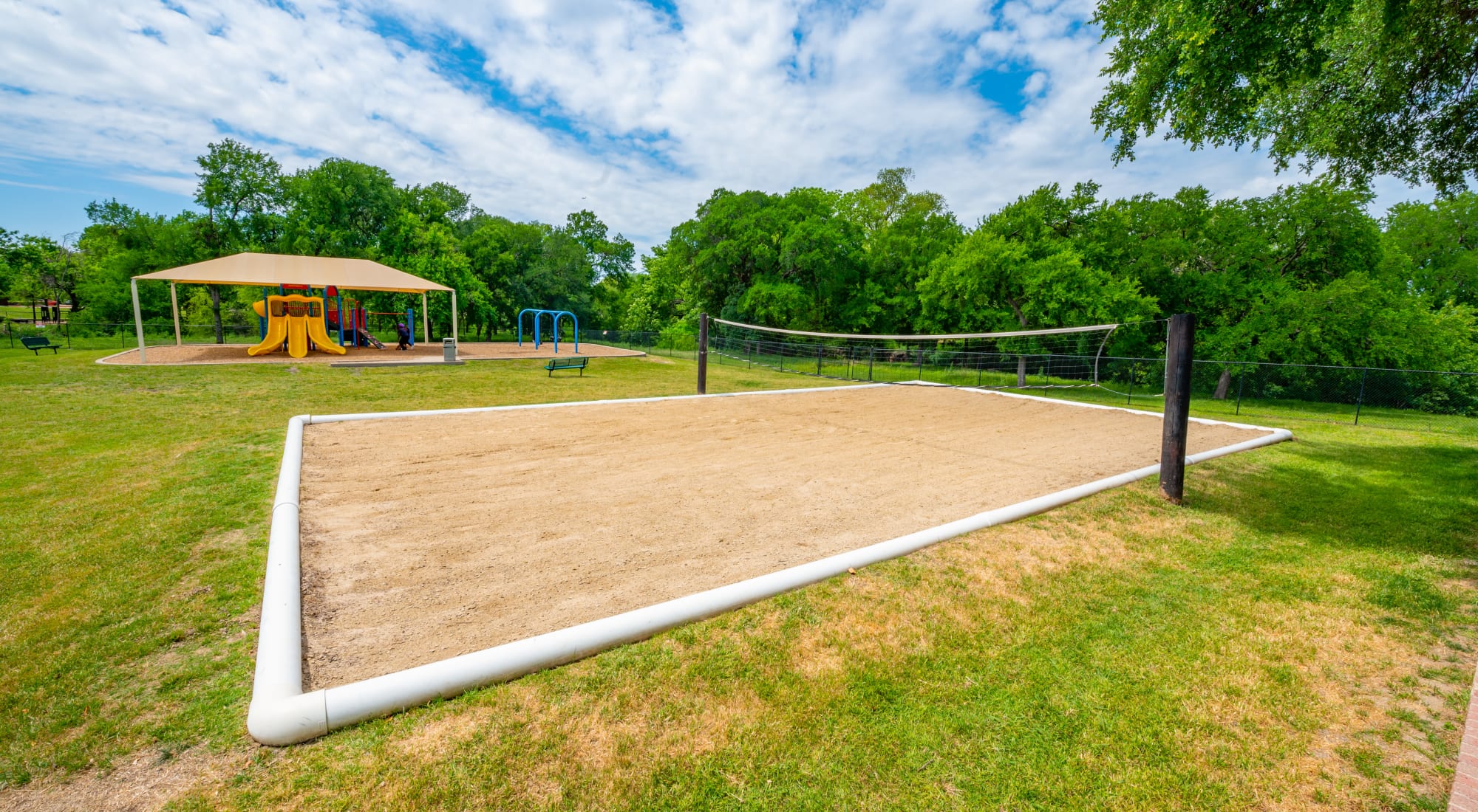 Sand Volleyball Court and Playground at Carrollton Park of North Dallas