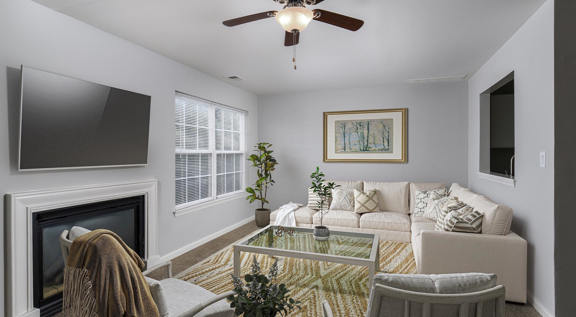 Living room with ceiling fan at Iron Ridge and Stonegate Apartments in Elkton, Maryland