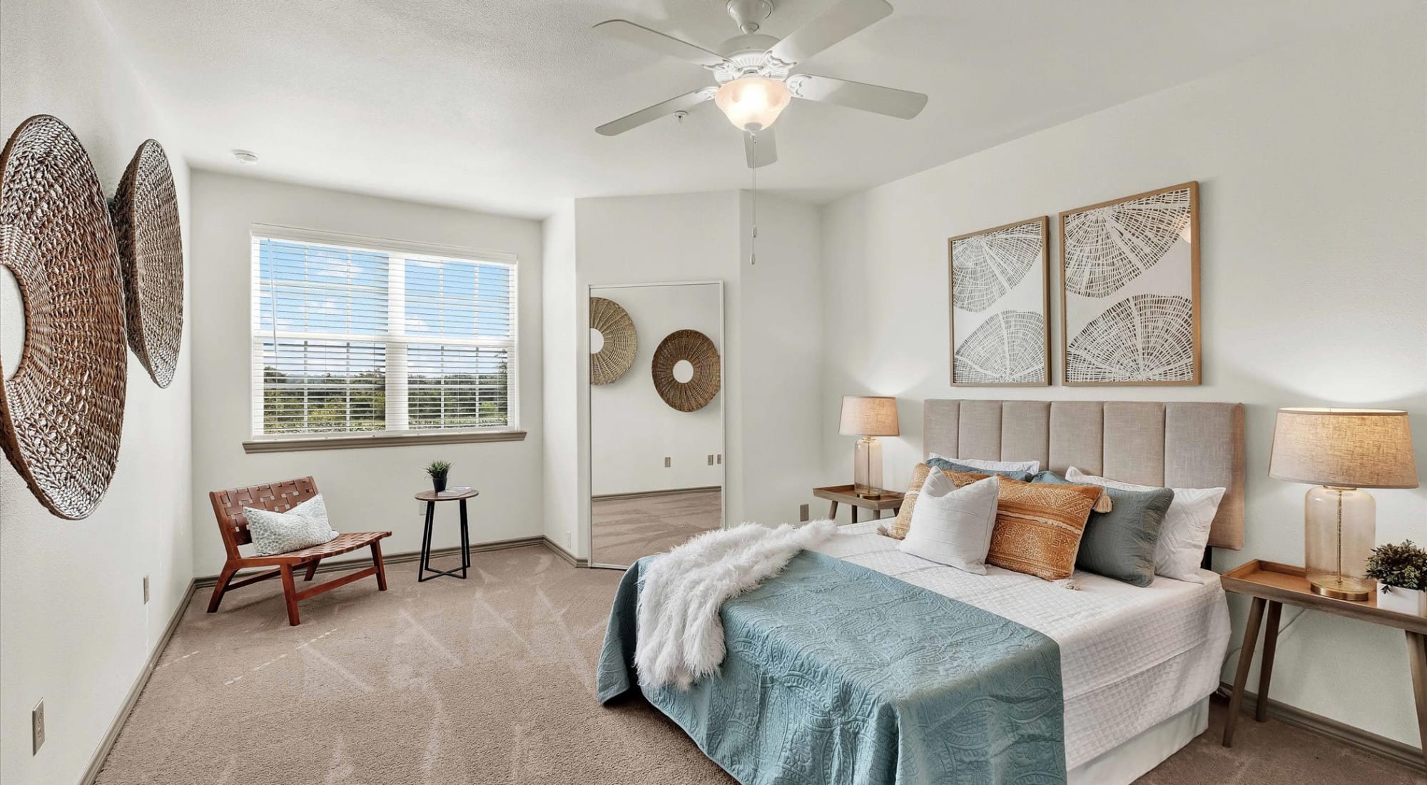 Spacious bedroom with ceiling fan at Villas at Westover Hills