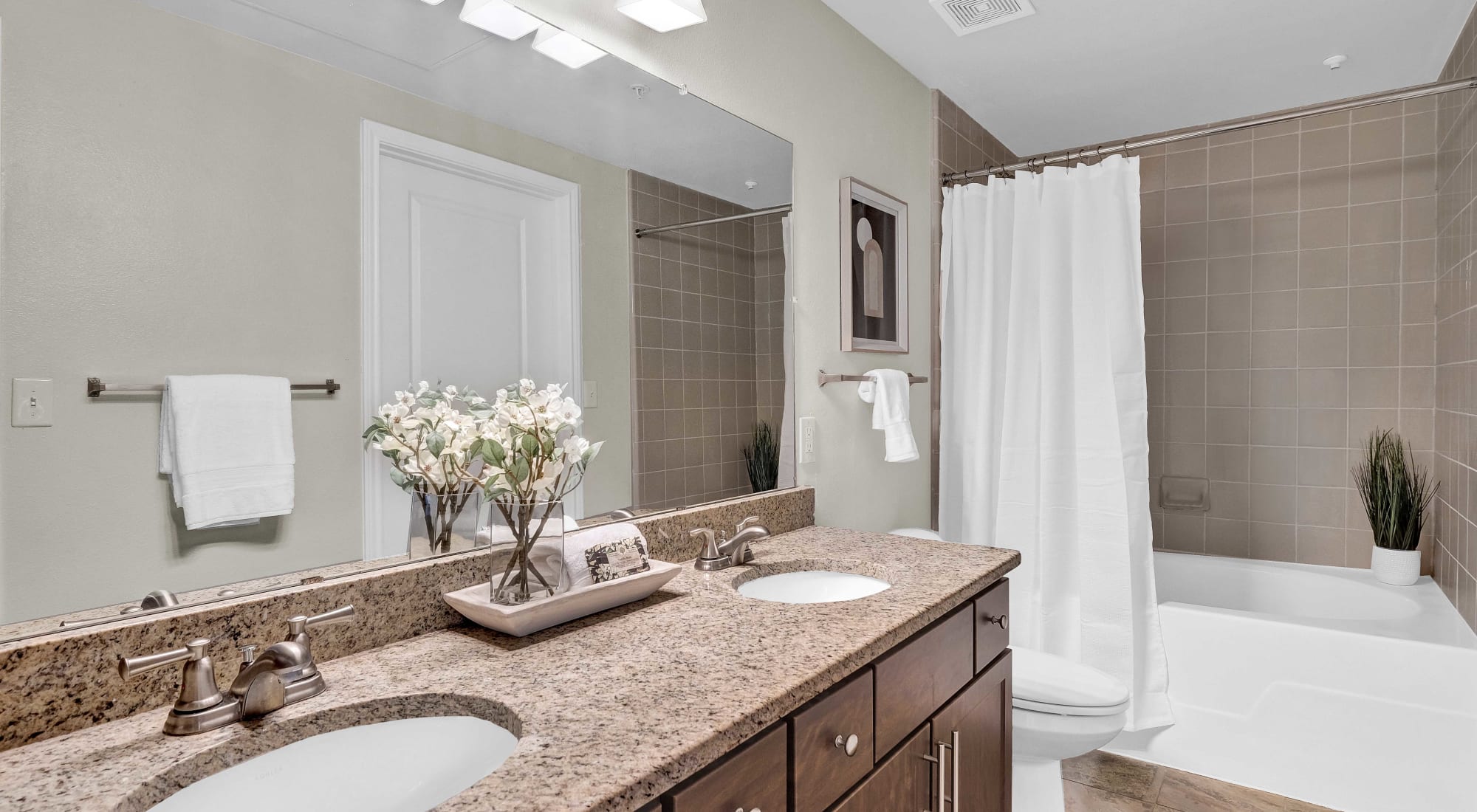 Bathroom with double vanity at The Lodge at Westover Hills in San Antonio, Texas
